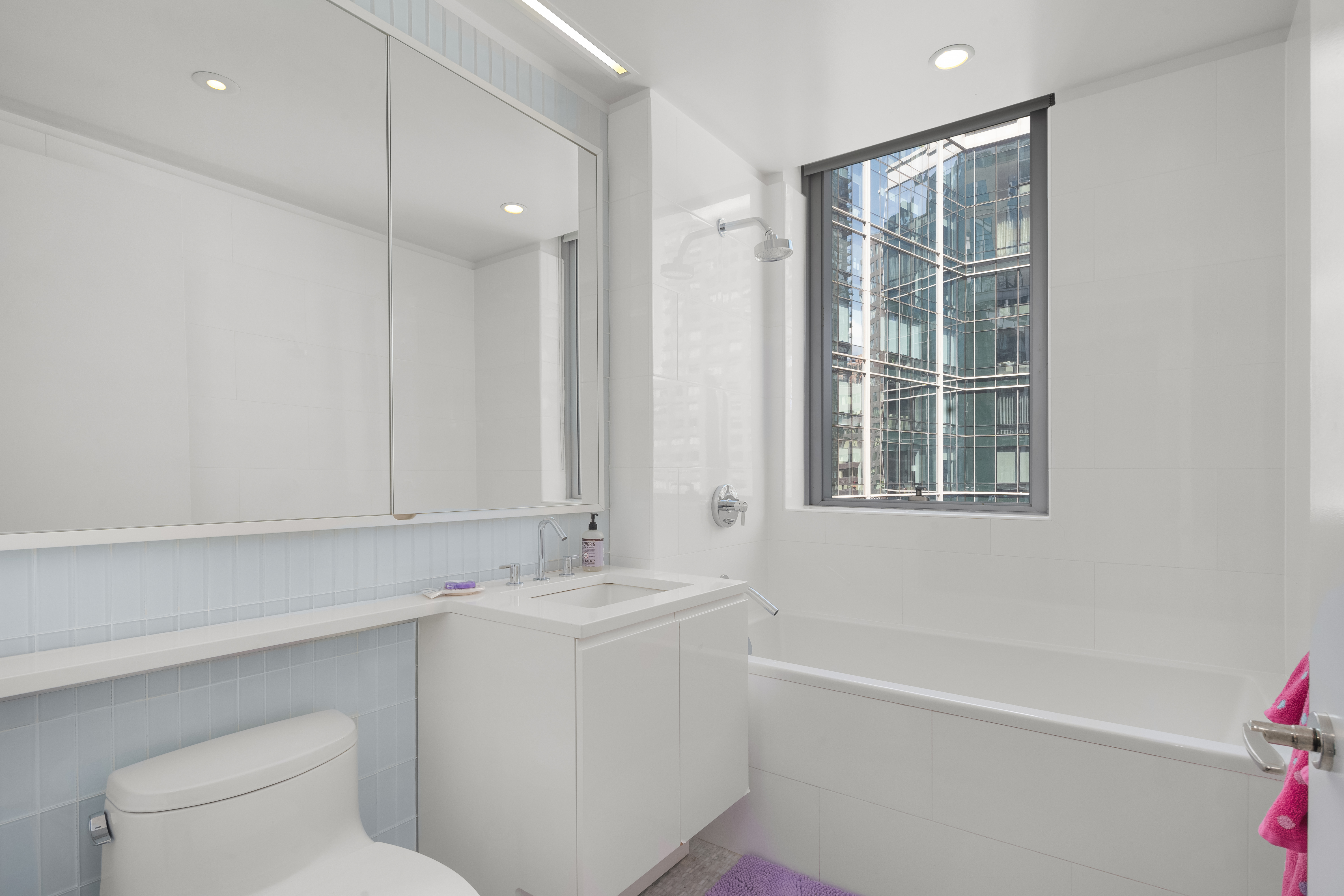 50 Riverside Boulevard, Unit 10P Manhattan, NY 10069 - Photo 12 of 21 a bathroom with a sink a toilet and shower