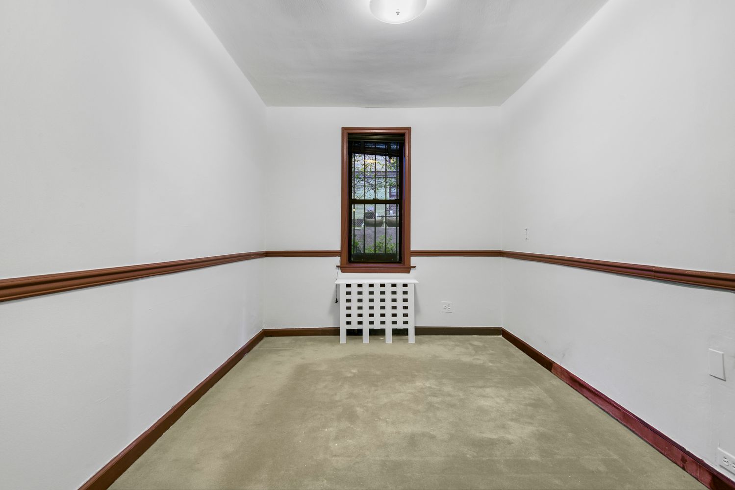 a view of a brick house with table and chairs