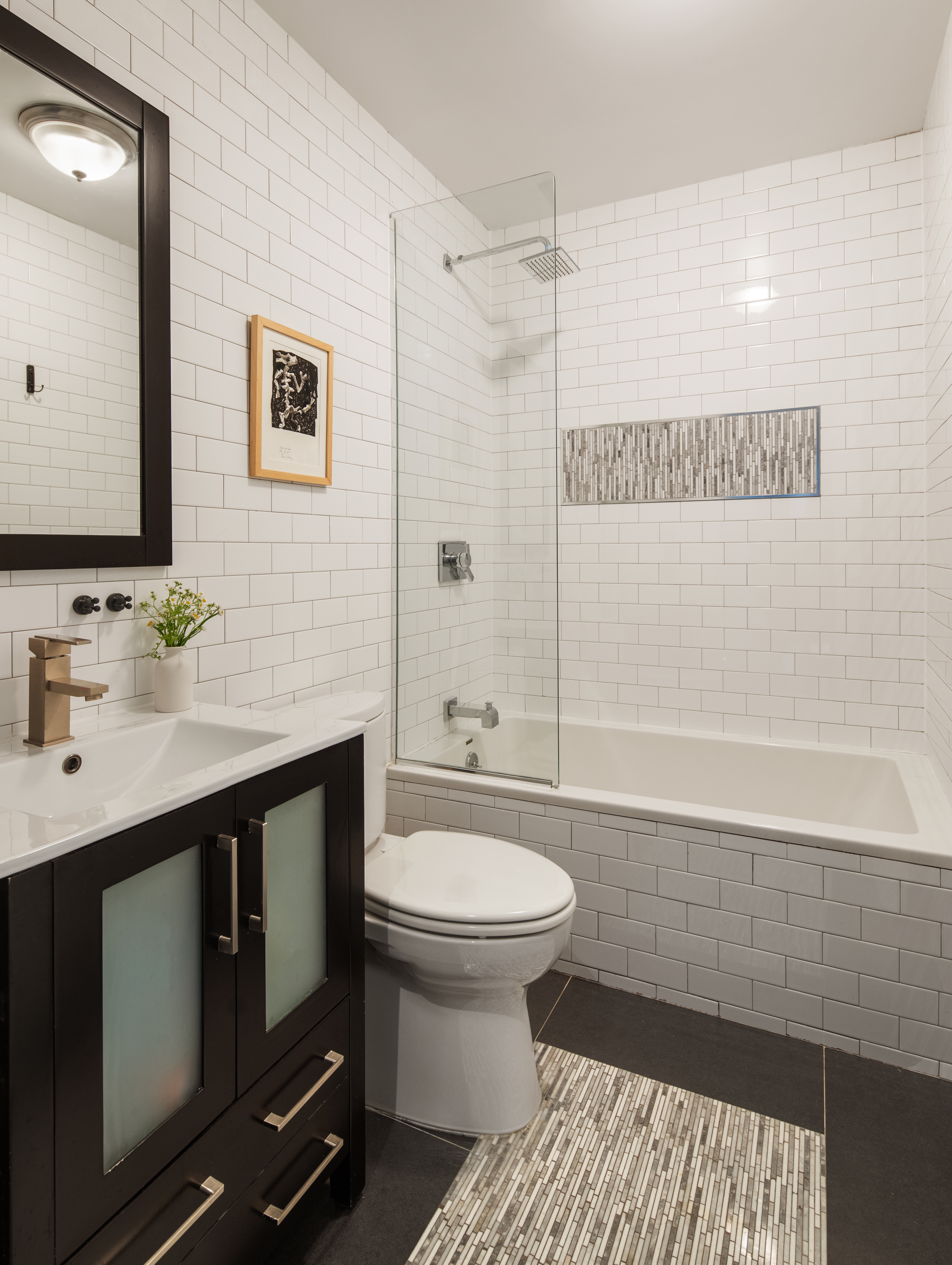 161 Jackson Street, Unit 1 Brooklyn, NY 11211 - Photo 9 of 11 a bathroom with a sink a toilet and shower