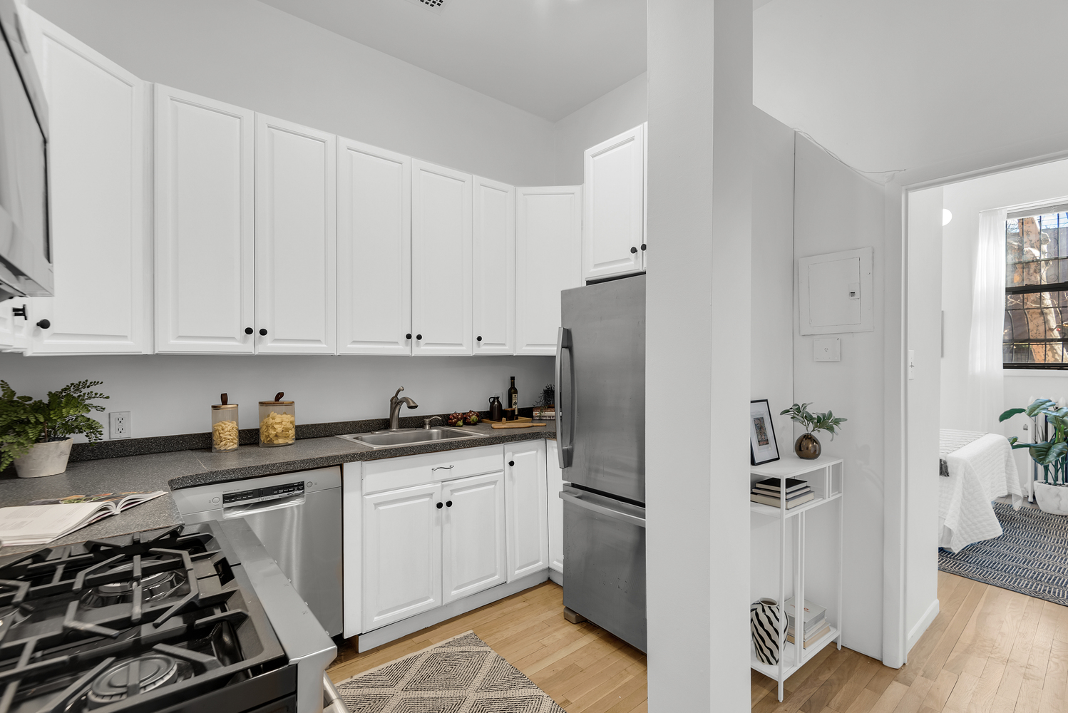 420 6th Avenue, Unit 11 Brooklyn, NY 11215 - Photo 4 of 12 a kitchen with stainless steel appliances a refrigerator sink and stove