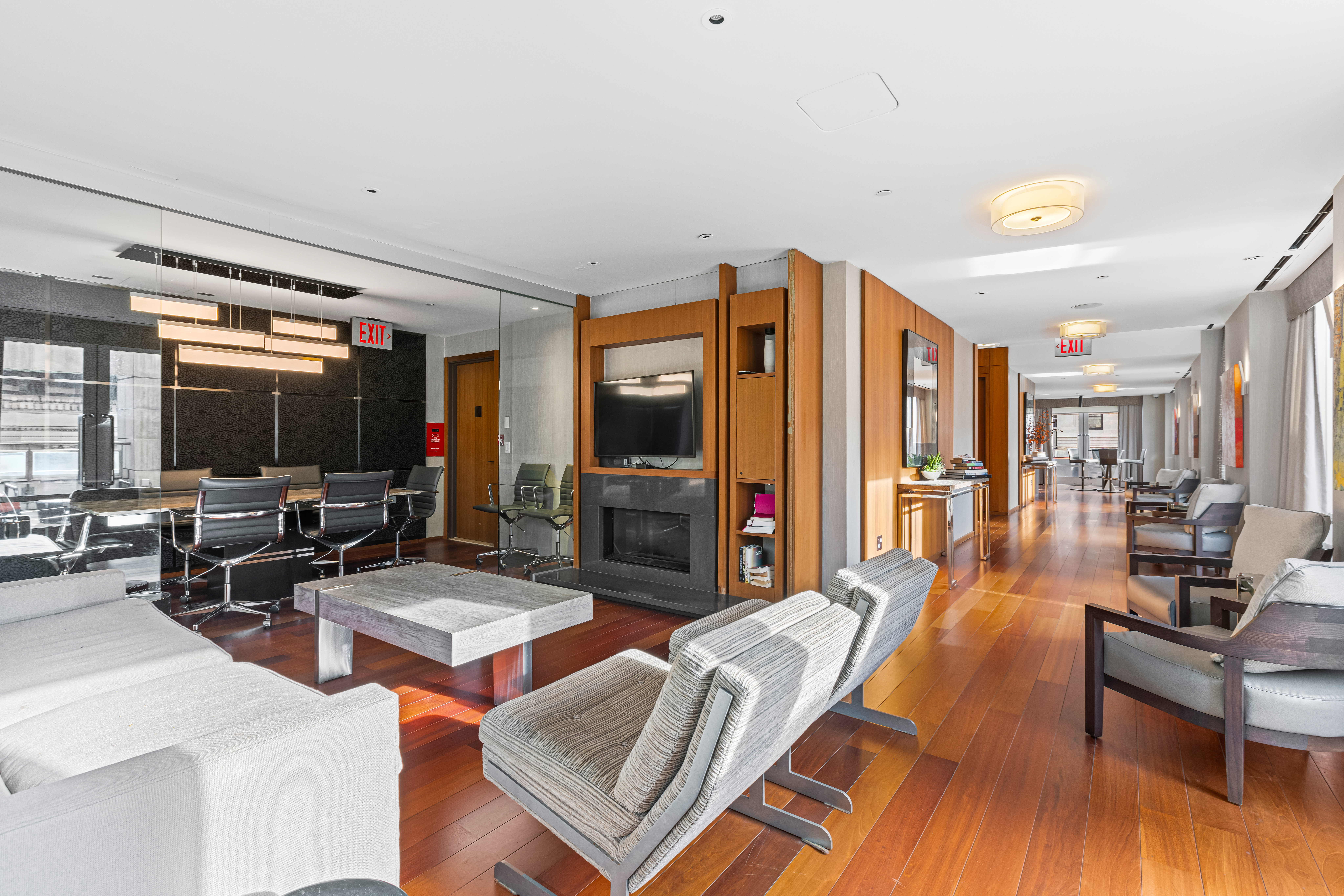 400 5th Avenue, Unit 49C Manhattan, NY 10018 - Photo 17 of 21 a living room with furniture and a flat screen tv