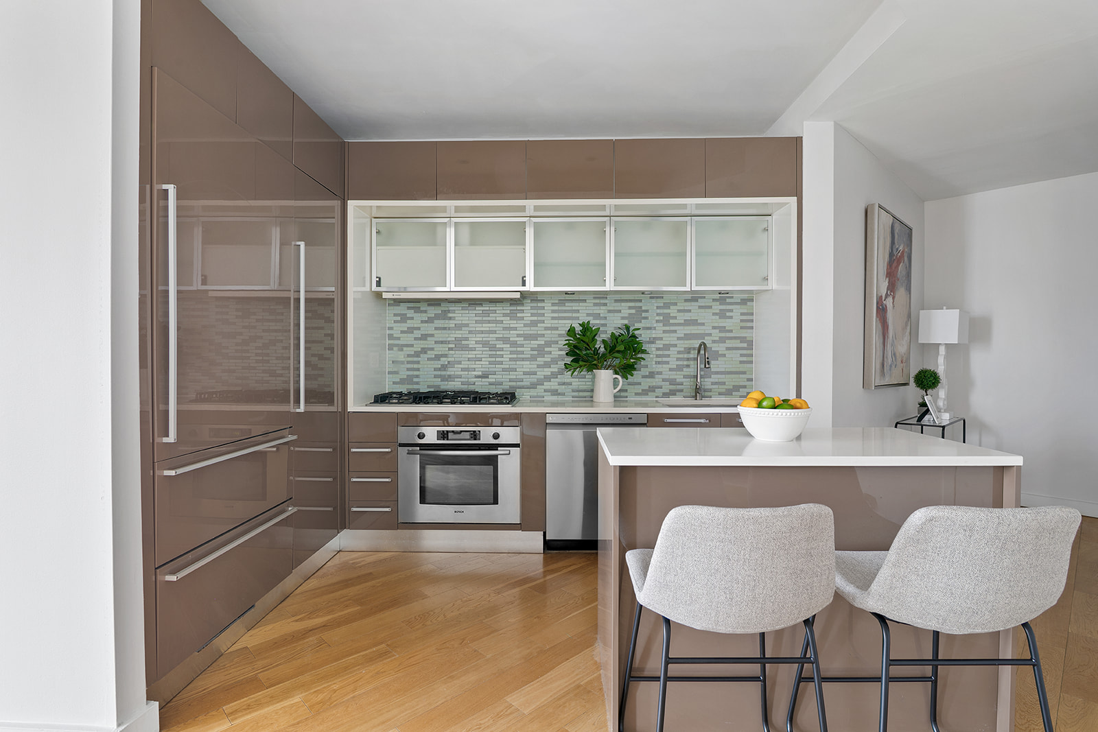 75 Wall Street, Unit 36F Manhattan, NY 10005 - Photo 3 of 15 a kitchen with granite countertop a stove a sink and a refrigerator