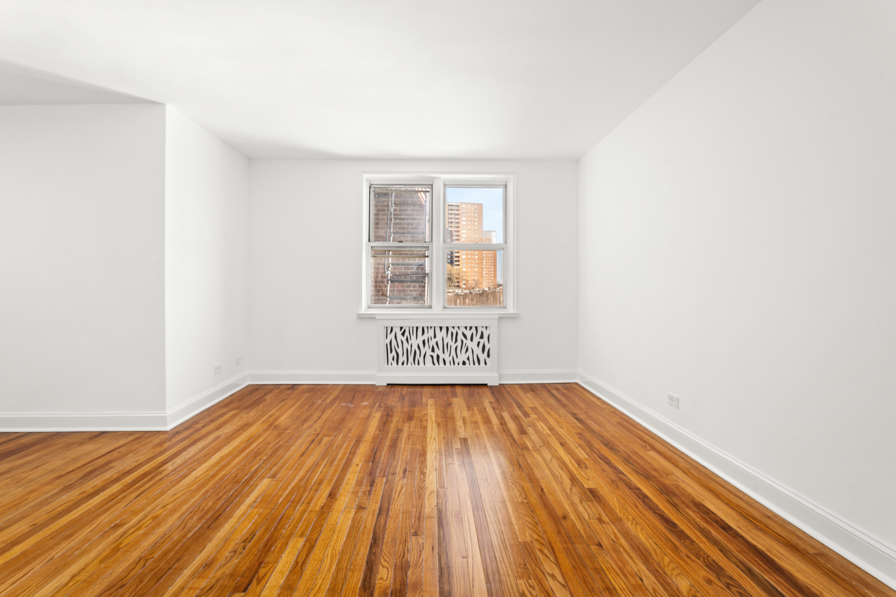 5650 Netherland Avenue, Unit 6C Bronx, NY 10471 - Photo 11 of 16 a view of a room with wooden floor and a sink