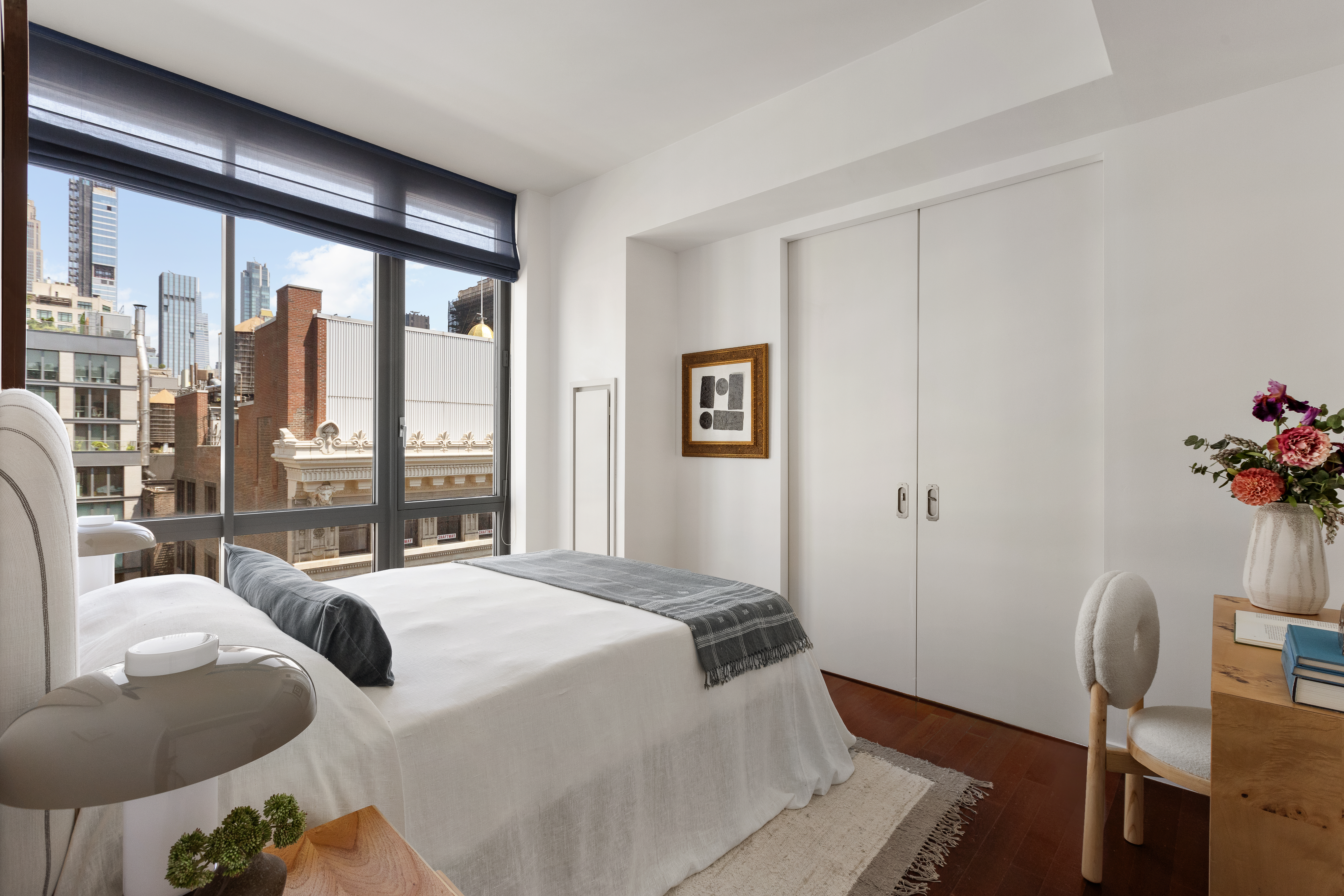 4 West 21st Street, Unit 16A Manhattan, NY 10010 - Photo 8 of 15 a bedroom with furniture and a large window