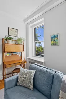 a living room with furniture and a window