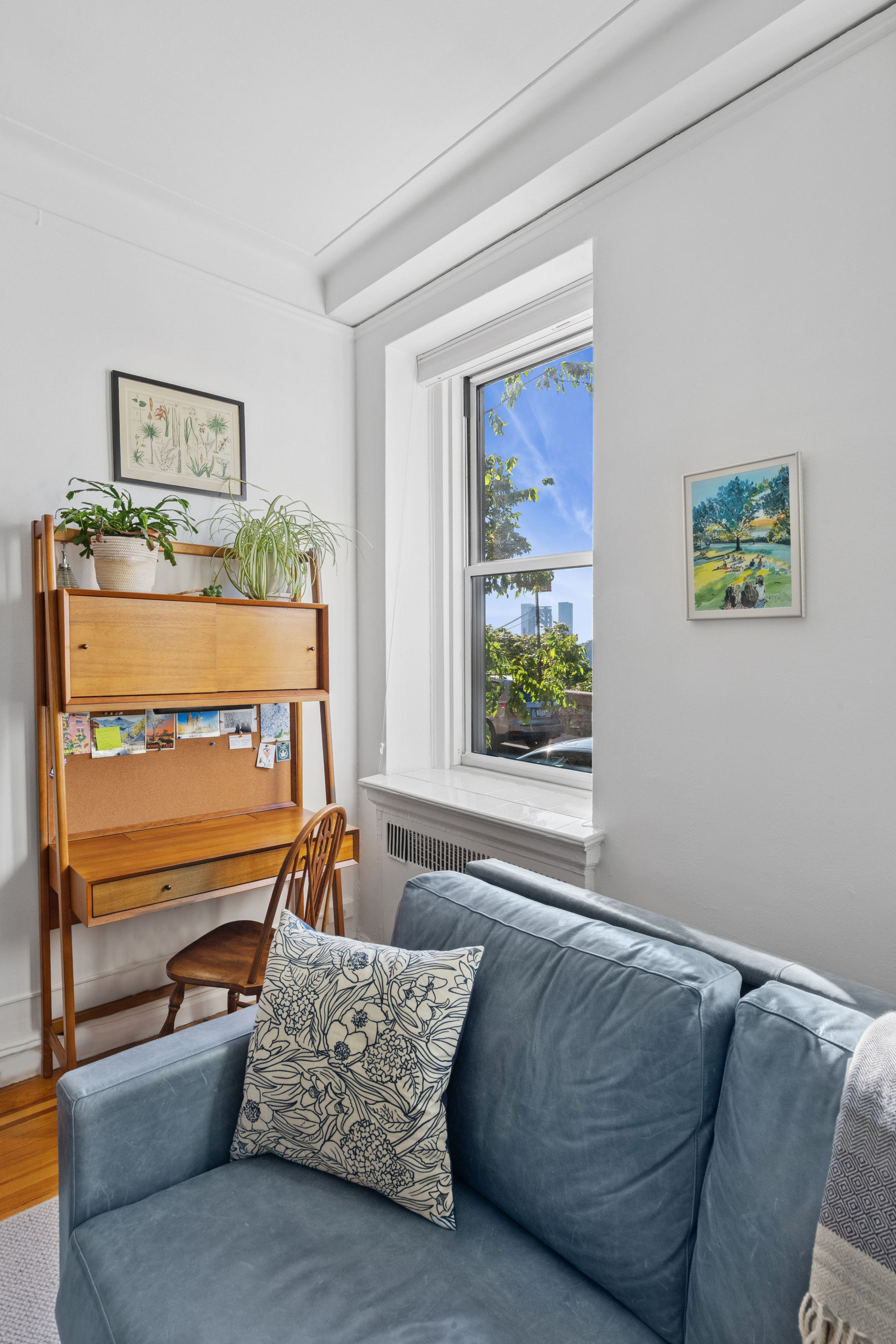 250 Cabrini Boulevard, Unit 1H Manhattan, NY 10033 - Photo 2 of 17 a living room with furniture and a window