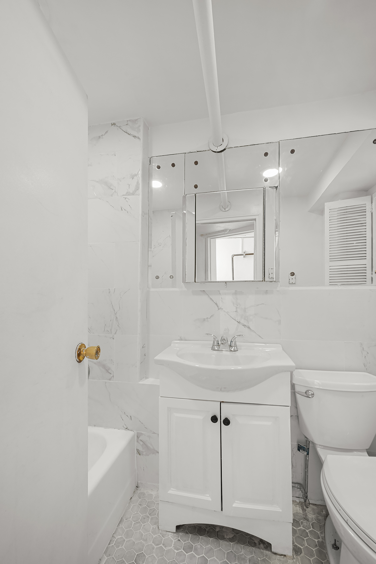 862 West End Avenue, Unit GARDEN Manhattan, NY 10025 - Photo 11 of 13 a bathroom with a sink a toilet and shower