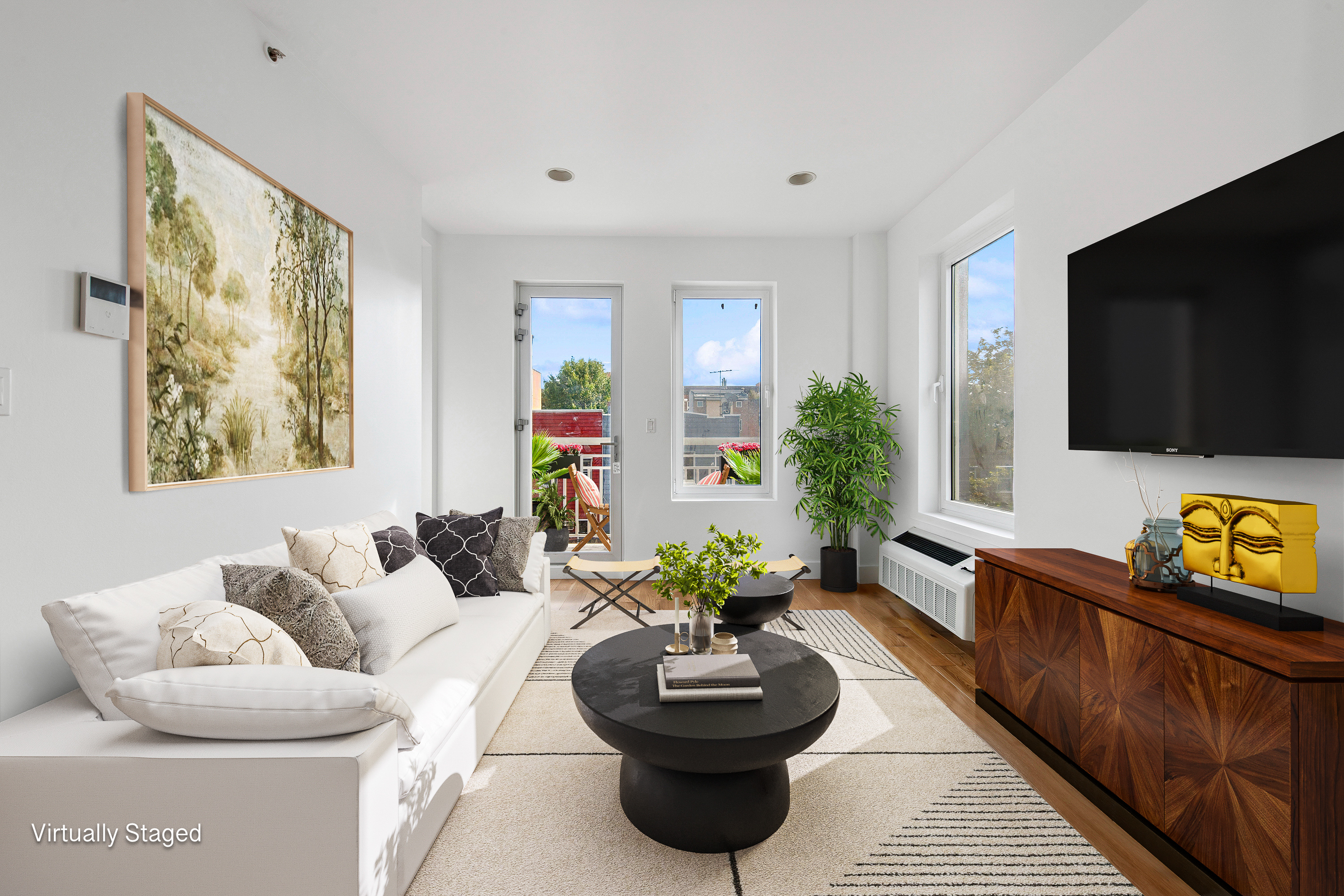 a living room with furniture and a flat screen tv