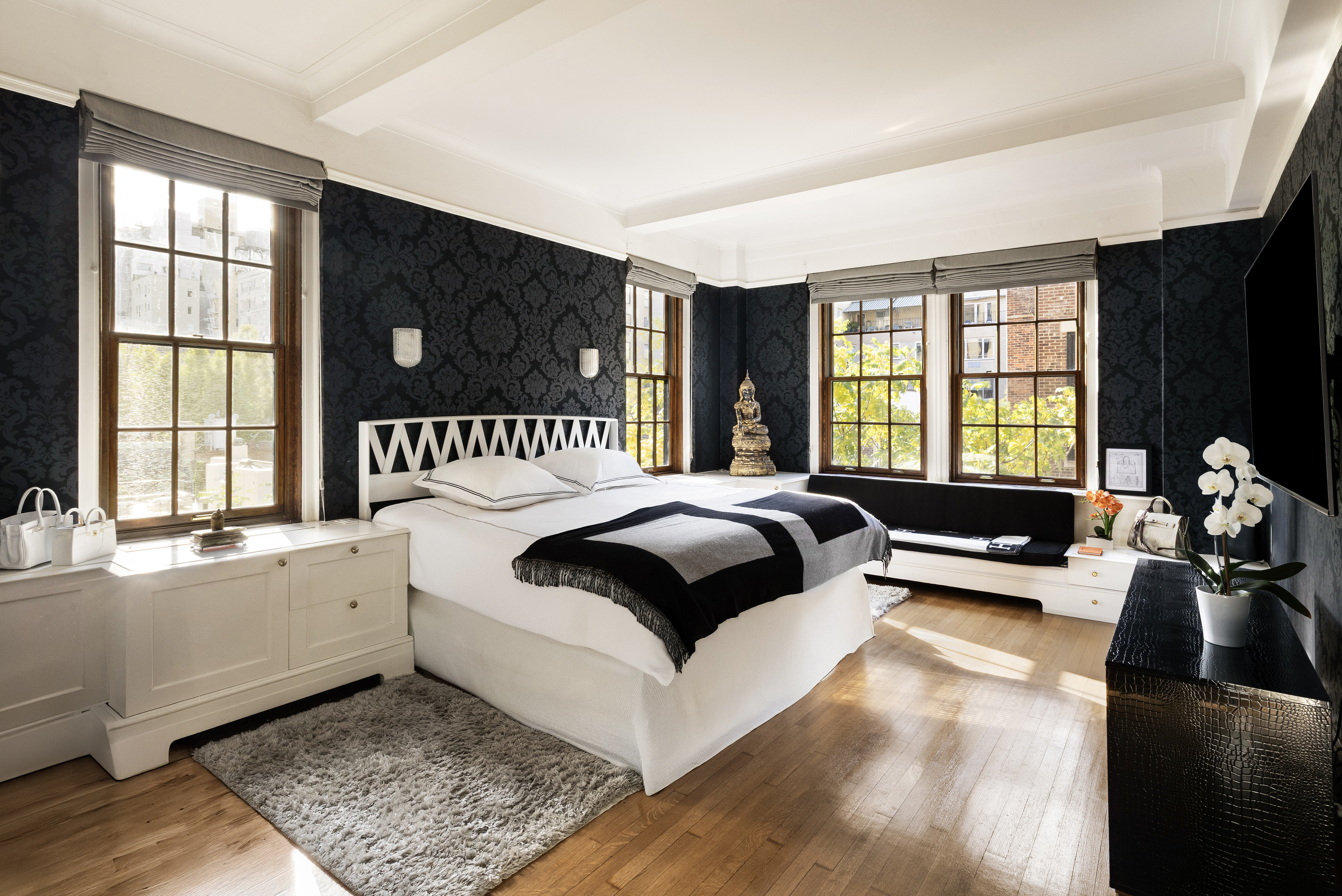 14 East 75th Street, Unit 7E Manhattan, NY 10021 - Photo 5 of 13 a bedroom with a bed and a large window