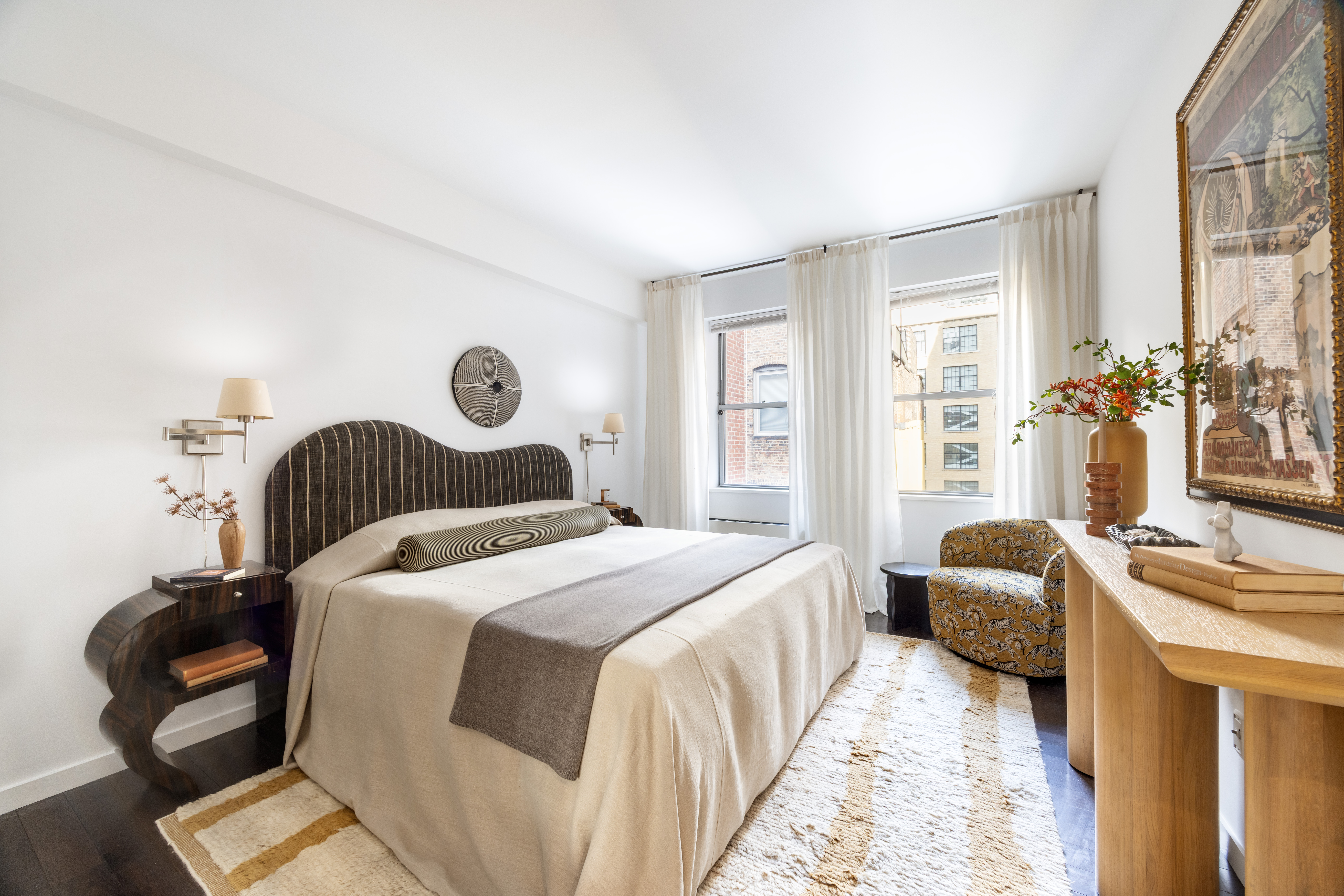 27 West 19th Street, Unit 6 Manhattan, NY 10011 - Photo 6 of 10 a bedroom with a bed and a couch