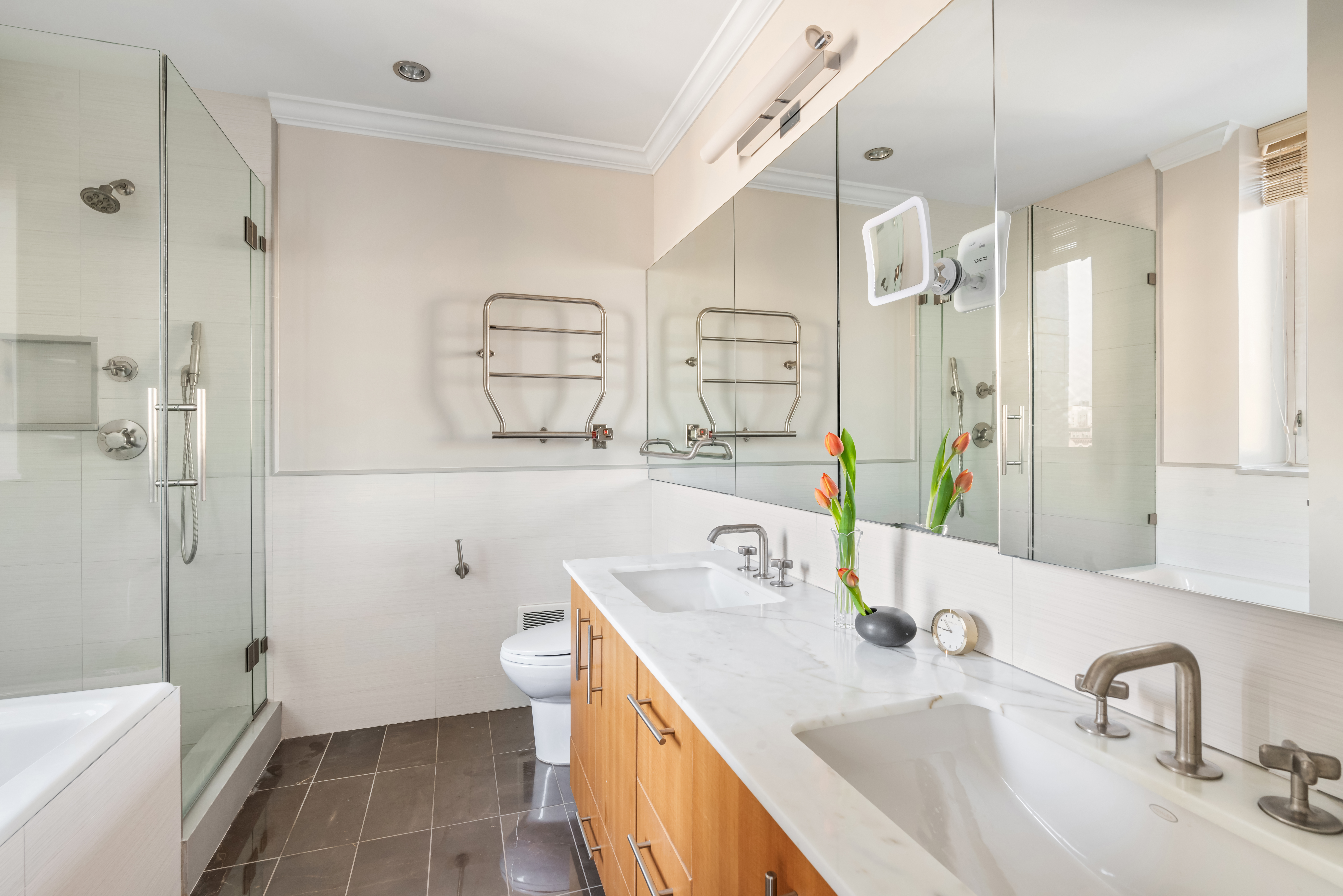 545 West 110th Street, Unit 9D Manhattan, NY 10025 - Photo 9 of 17 a bathroom with a sink toilet double vanity and shower
