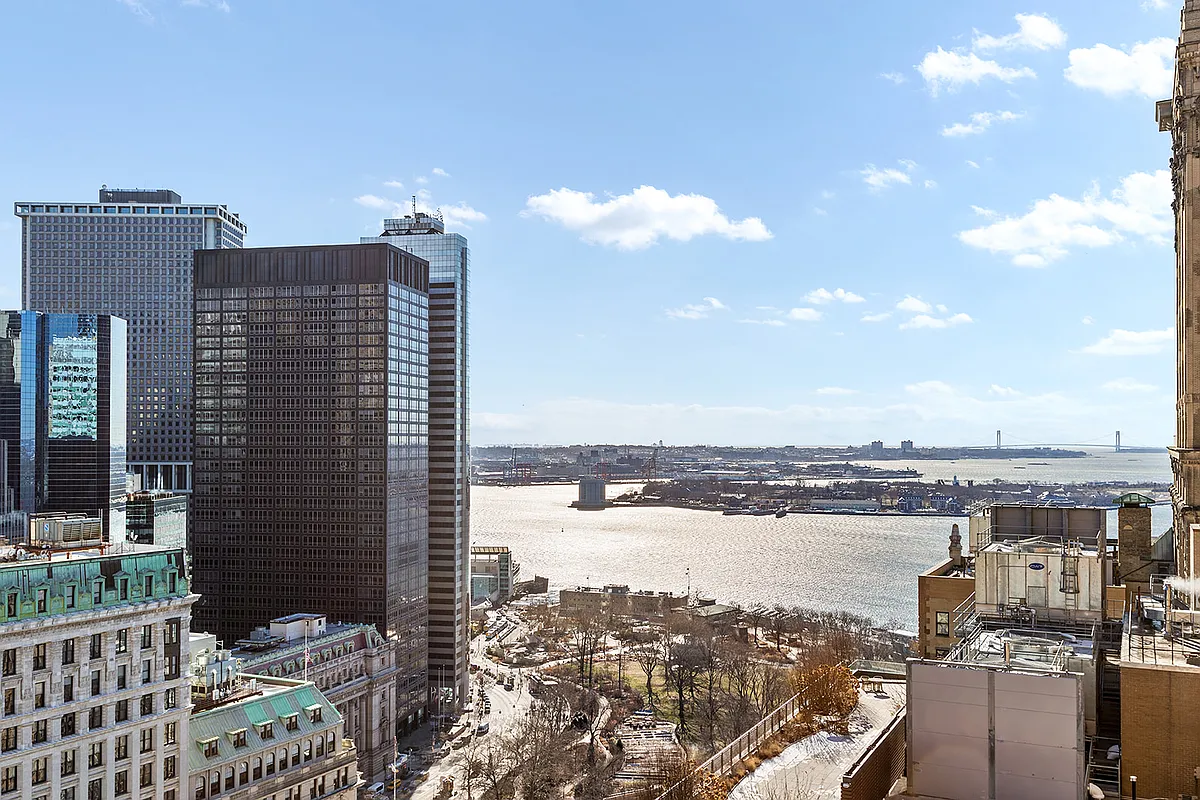 20 West Street, Unit 28F Manhattan, NY 10004 - Photo 8 of 18 a view of a city with ocean