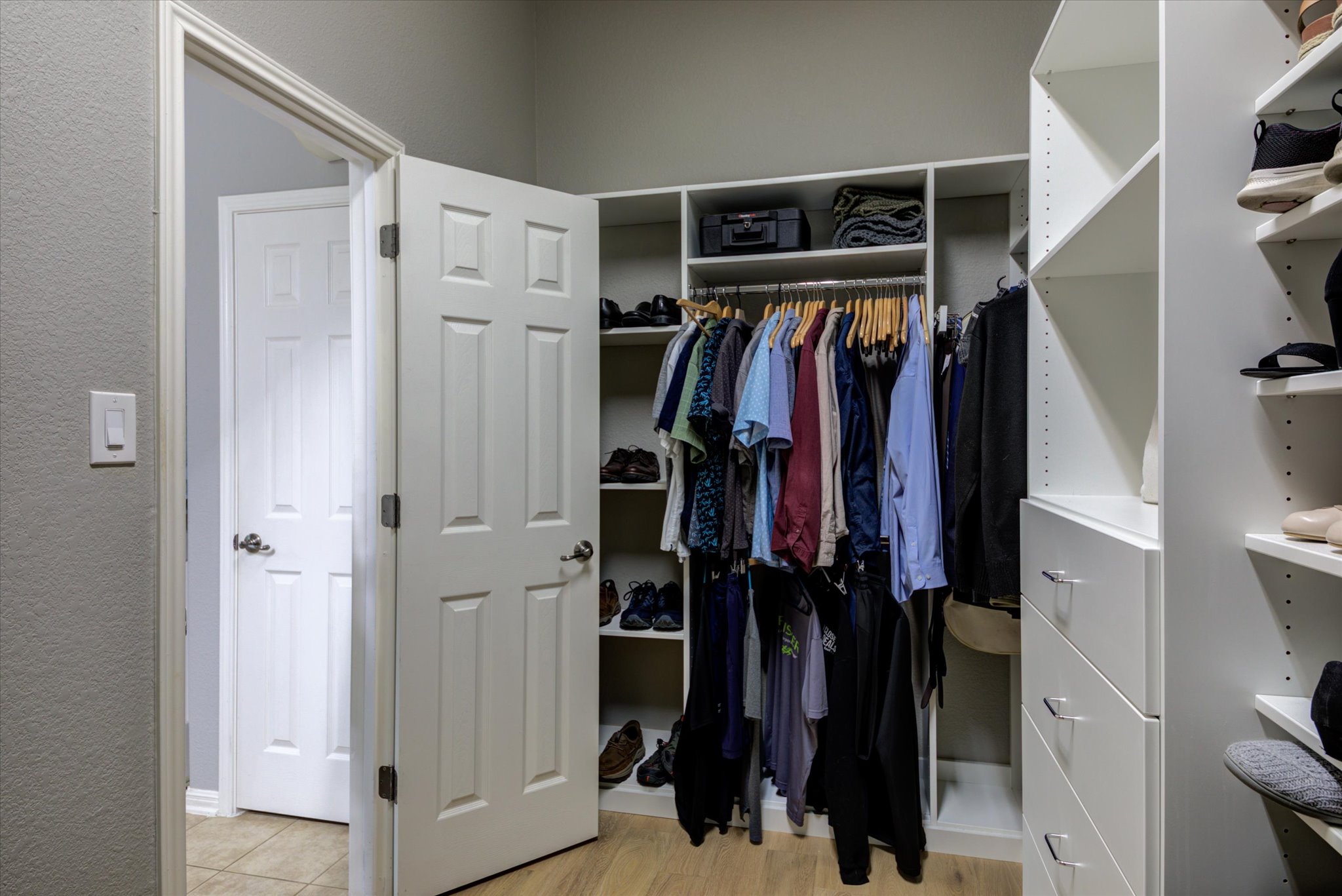 5412 Batak Lane Austin, TX 78749 - Photo 32 of 40 a view of walk in closet with clothes and shoes