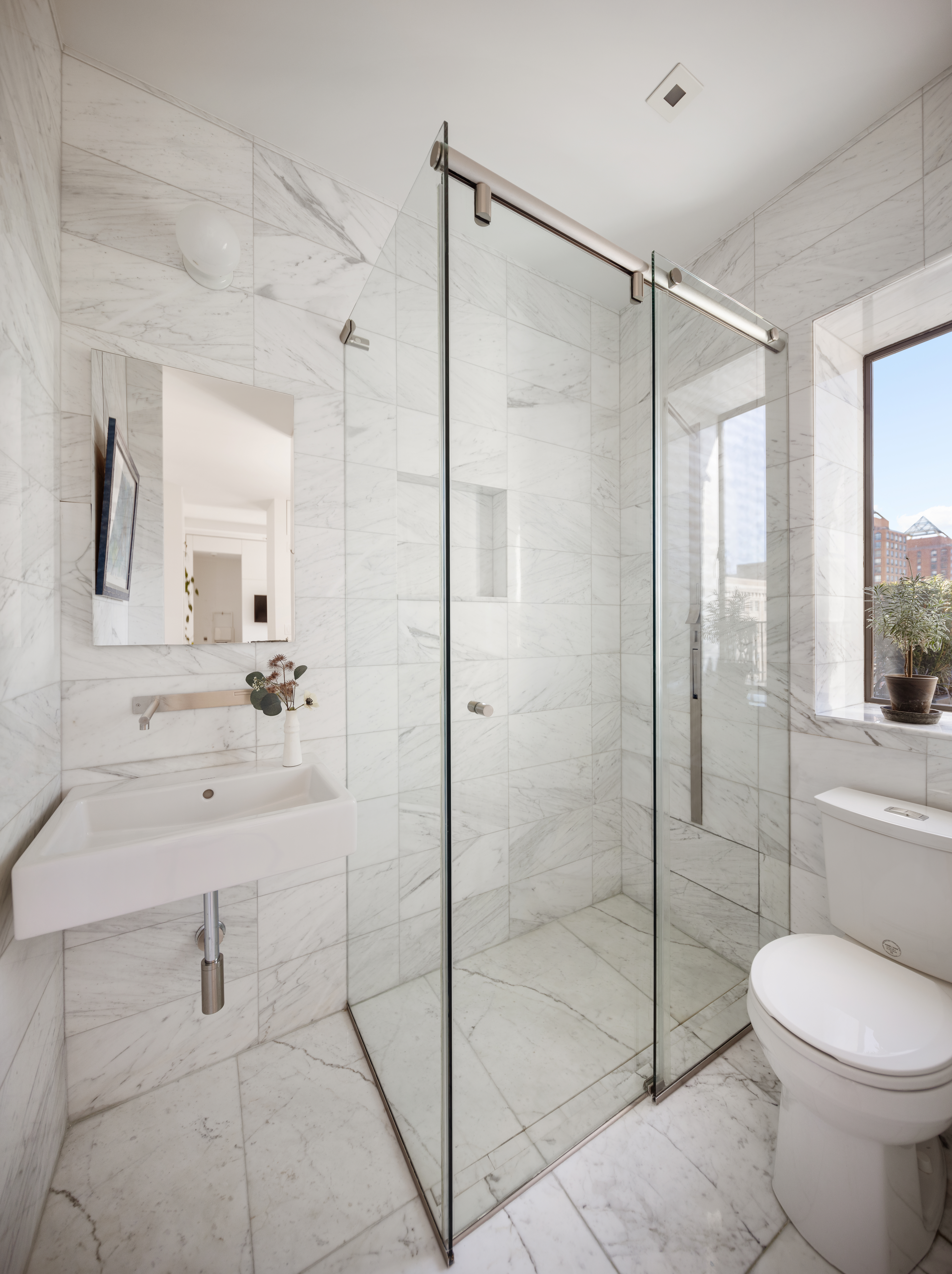 200 East 16th Street, Unit PHC Manhattan, NY 10003 - Photo 5 of 9 a bathroom with a shower a toilet and sink