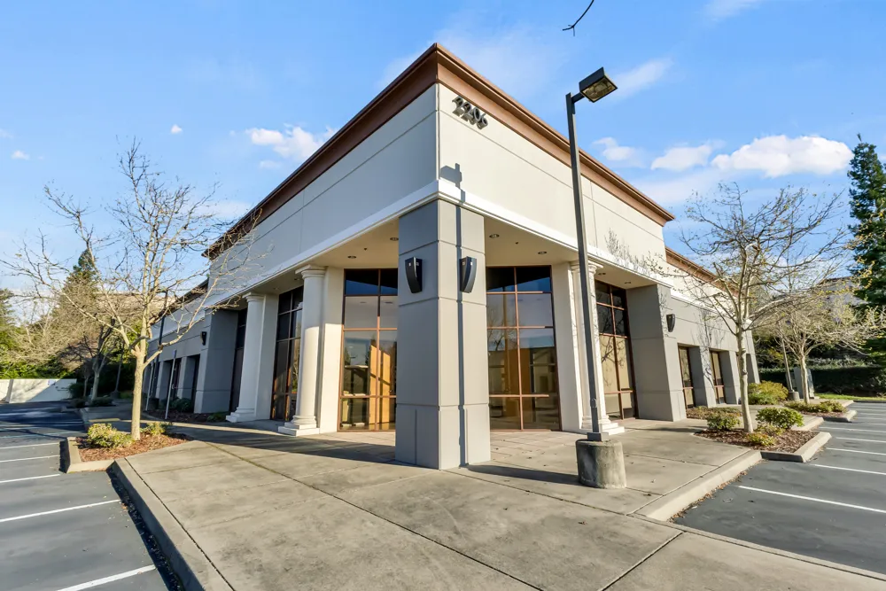 a view of a building with sitting area