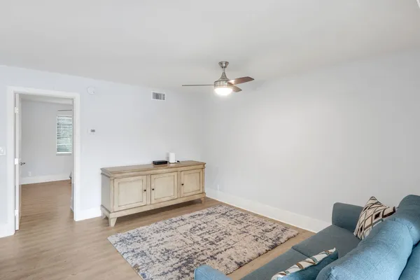 a living room with furniture and a rug