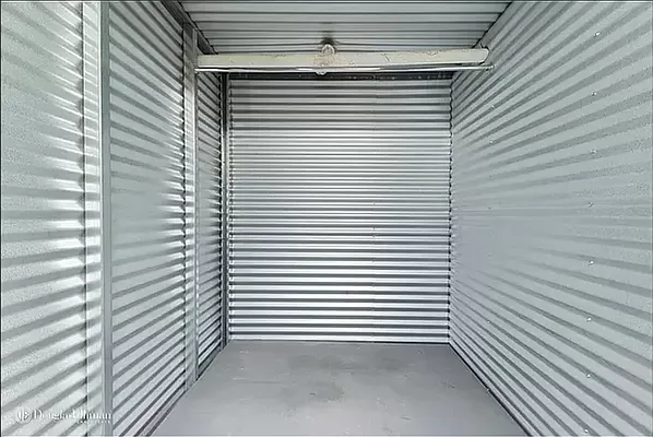 a view of a room with a window and a door