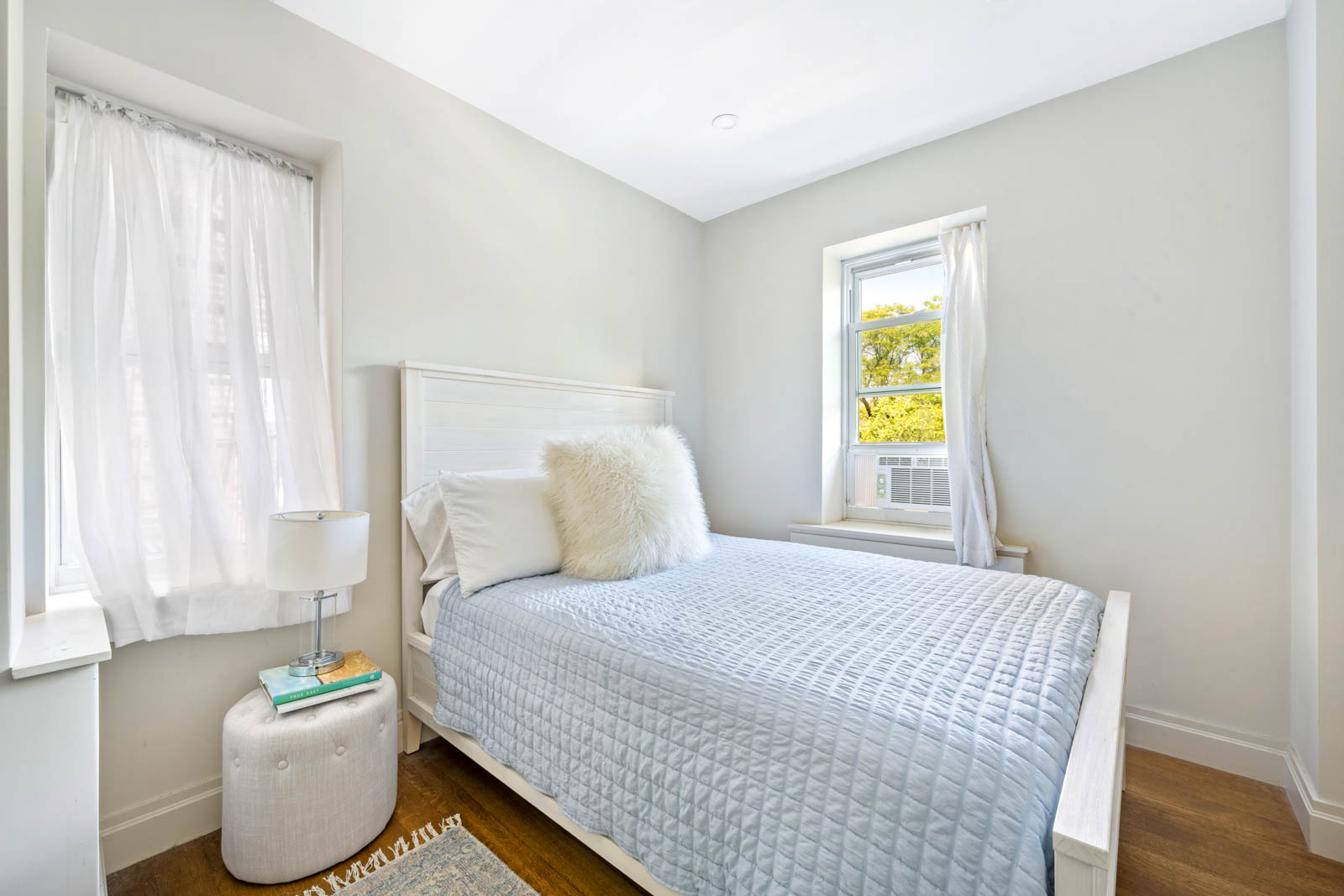 520 East 90th Street, Unit 3M Manhattan, NY 10128 - Photo 5 of 11 a bedroom with a bed and a window