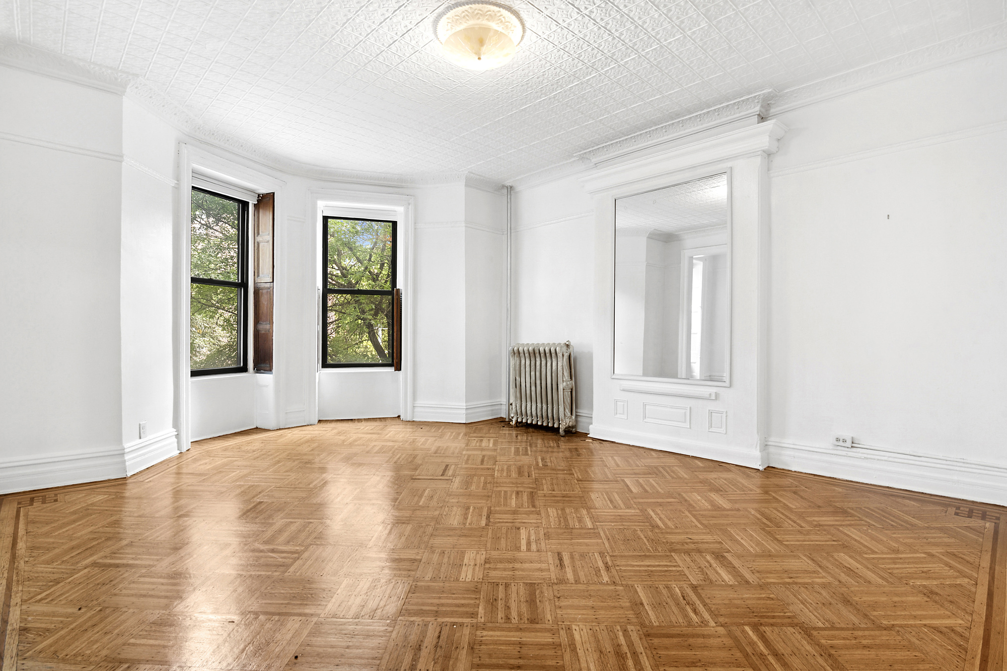 271 6th Avenue, Unit 2 Brooklyn, NY 11215 - Photo 2 of 8 a view of an empty room and window