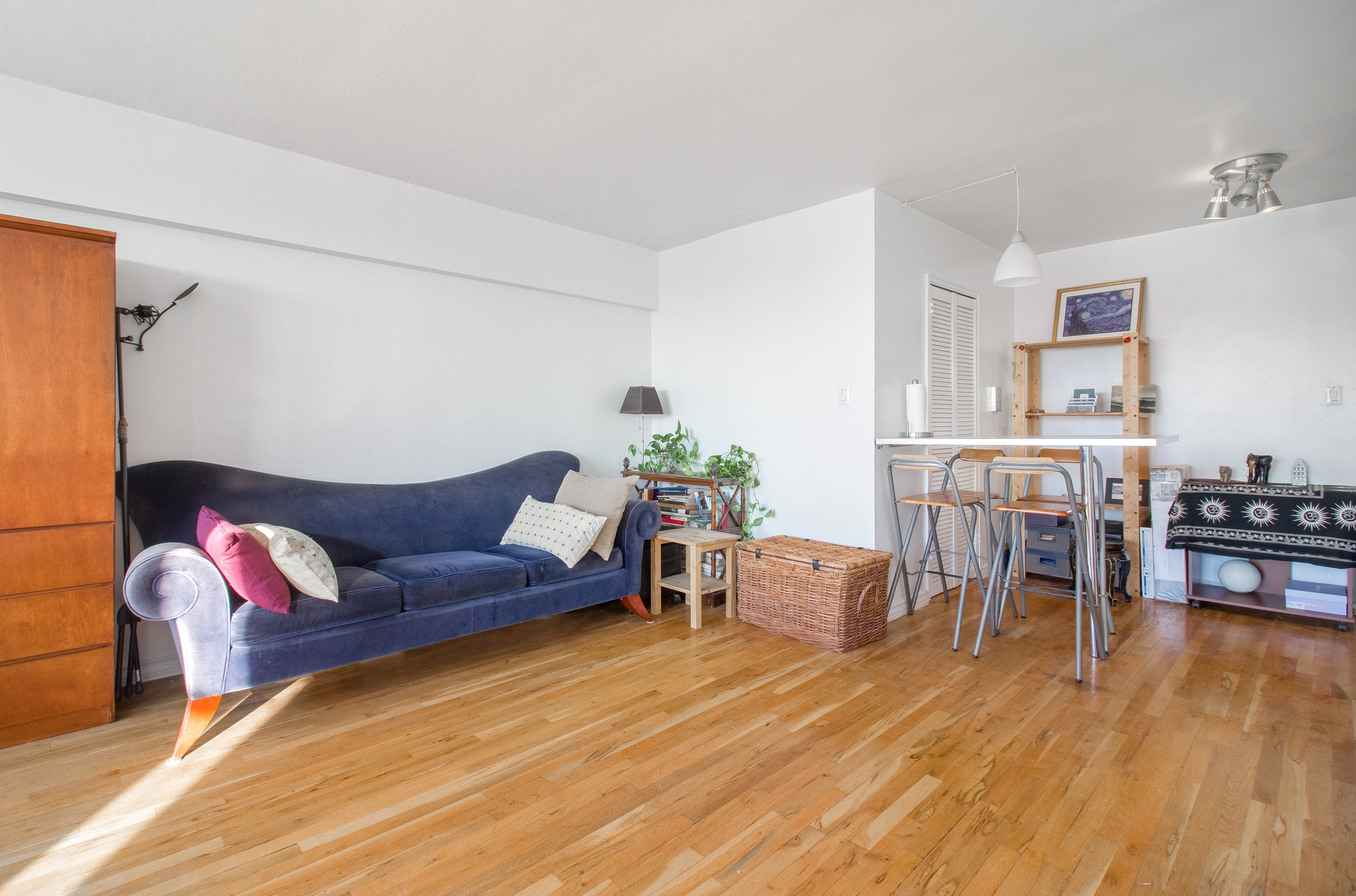 50-15 39th Street, Unit 4C Queens, NY 11104 - Photo 2 of 10 a living room with furniture and wooden floor