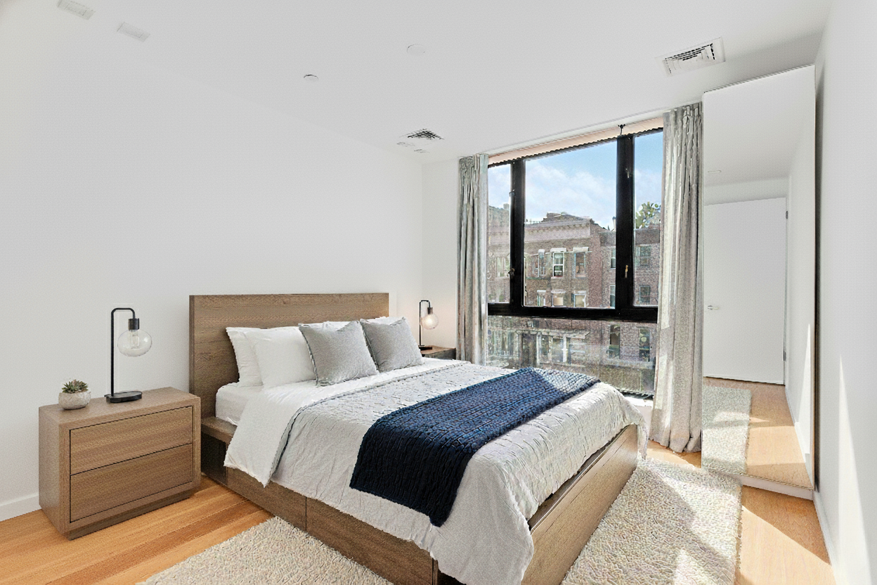 511 Lafayette Avenue, Unit 3A Brooklyn, NY 11205 - Photo 4 of 10 a bedroom with a large bed and a window