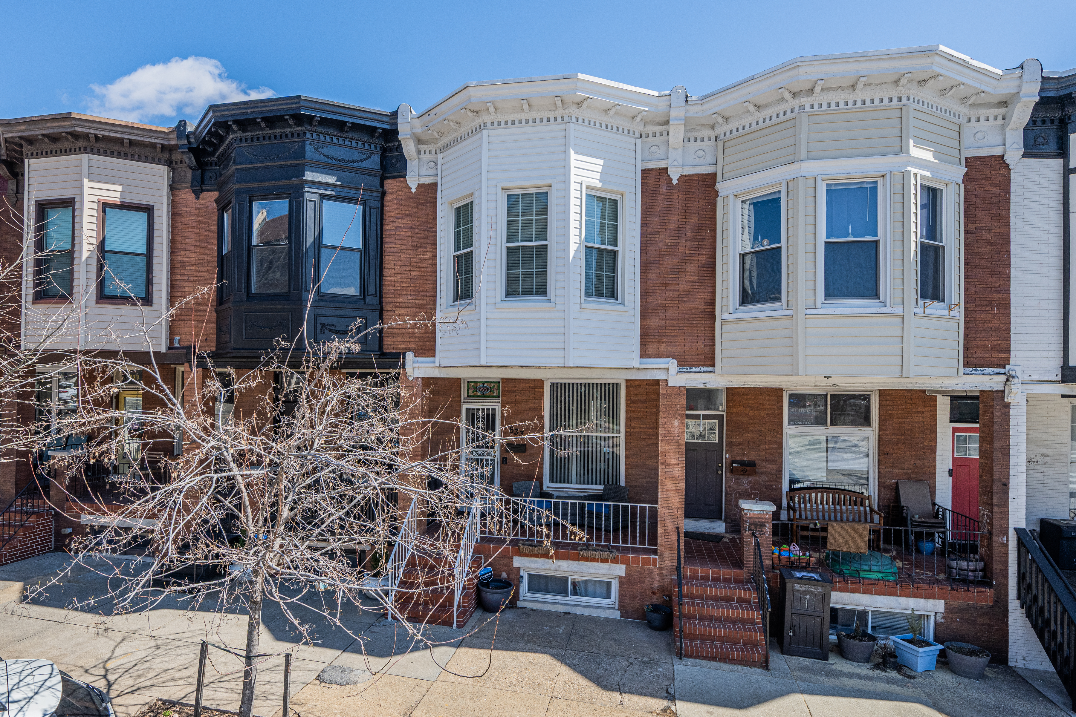 633 South Conkling Street Baltimore, MD 21224 - Photo 1 of 23 a front view of a multi story residential apartment building