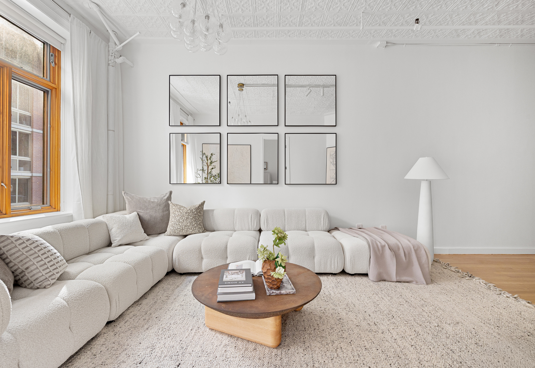 107 West 25th Street, Unit 5B Manhattan, NY 10001 - Photo 3 of 16 a living room with furniture and a window