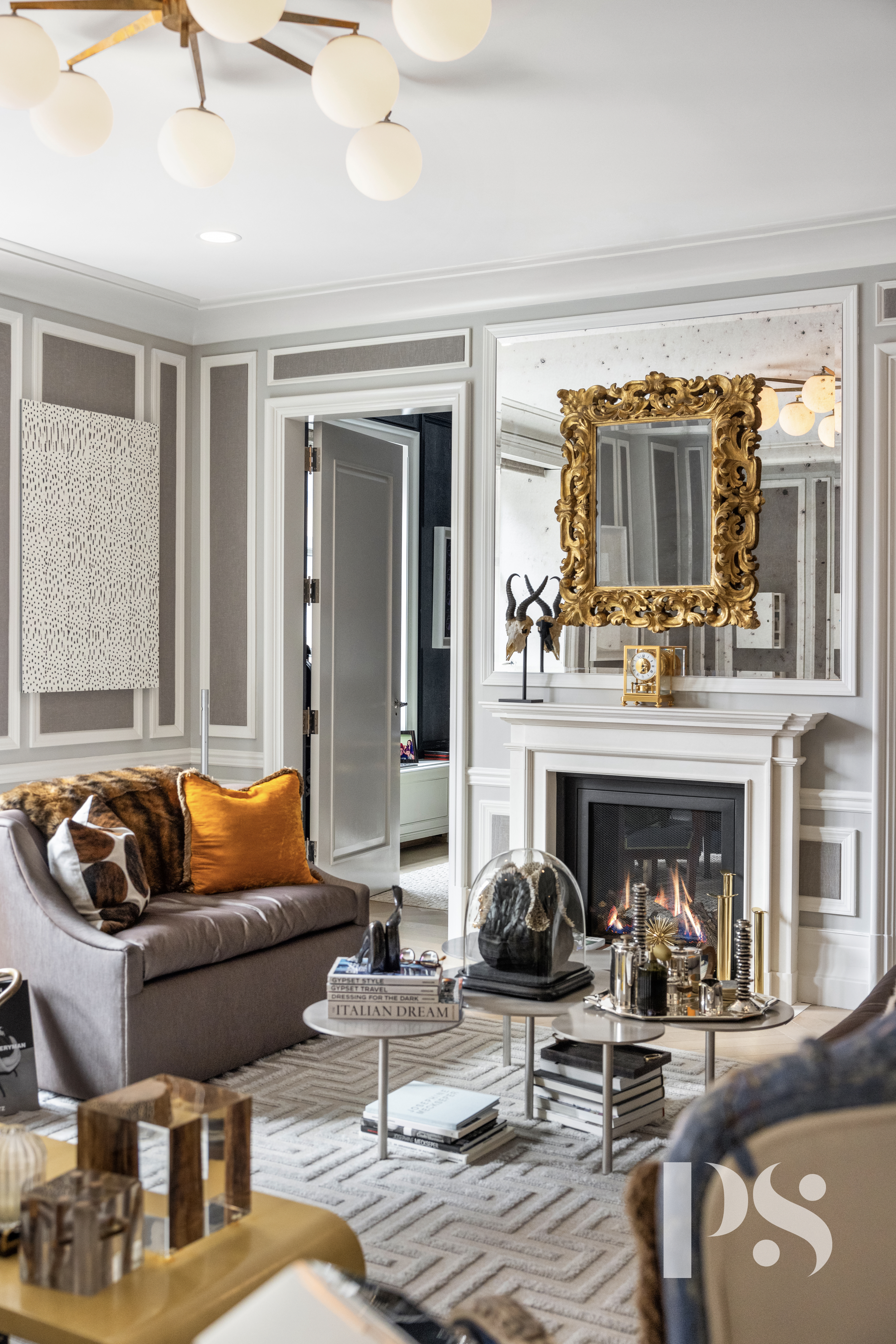 135 East 79th Street, Unit 8E Manhattan, NY 10075 - Photo 4 of 26 a living room with furniture and a fireplace