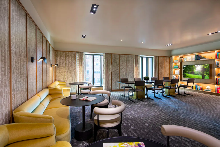 40 East End Avenue, Unit 9B Manhattan, NY 10028 - Photo 23 of 25 a living room with furniture and a large window