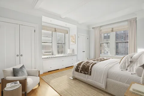 a bedroom with furniture and a book shelf