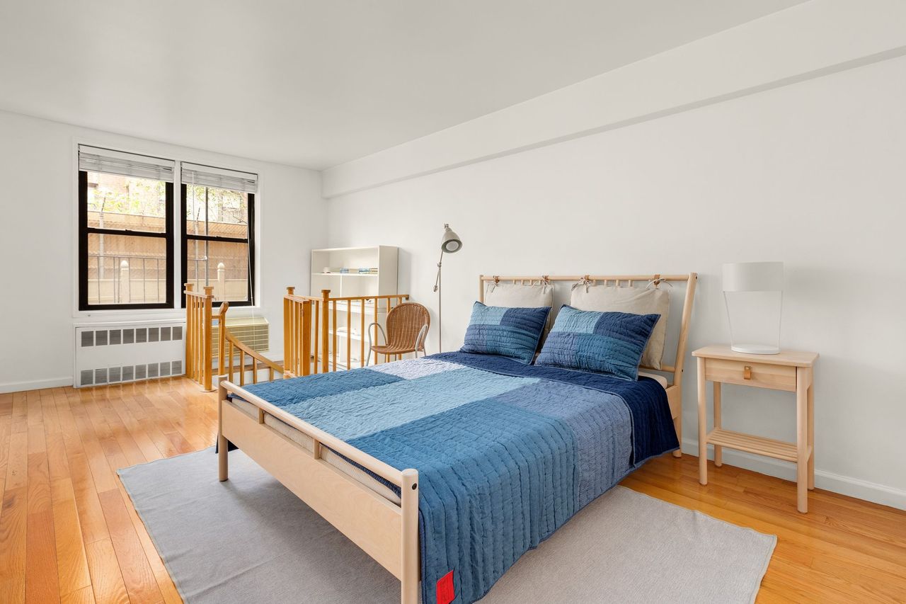 342 East 53rd Street, Unit 1G Manhattan, NY 10022 - Photo 5 of 9 a living room with furniture and a table