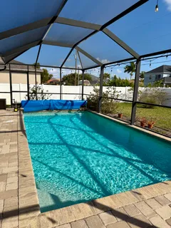 a view of a backyard with sitting area