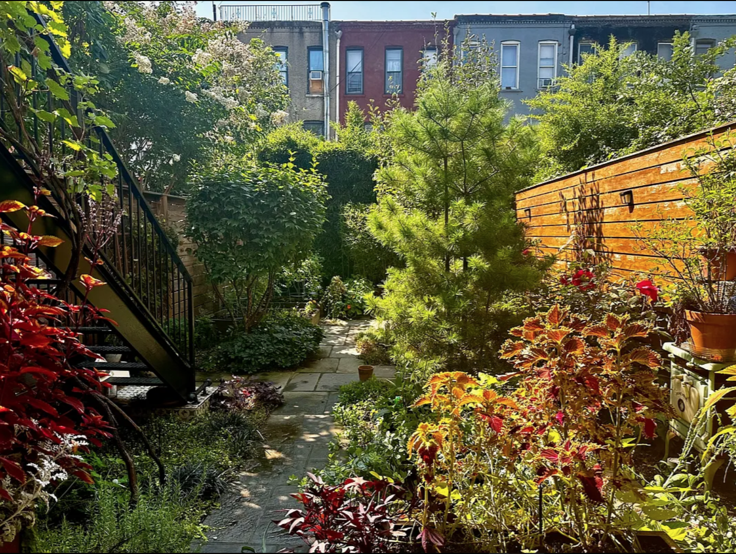 430 East 140th Street, Unit 2 Bronx, NY 10454 - Photo 8 of 10 a view of a multi story yard with plants and large trees