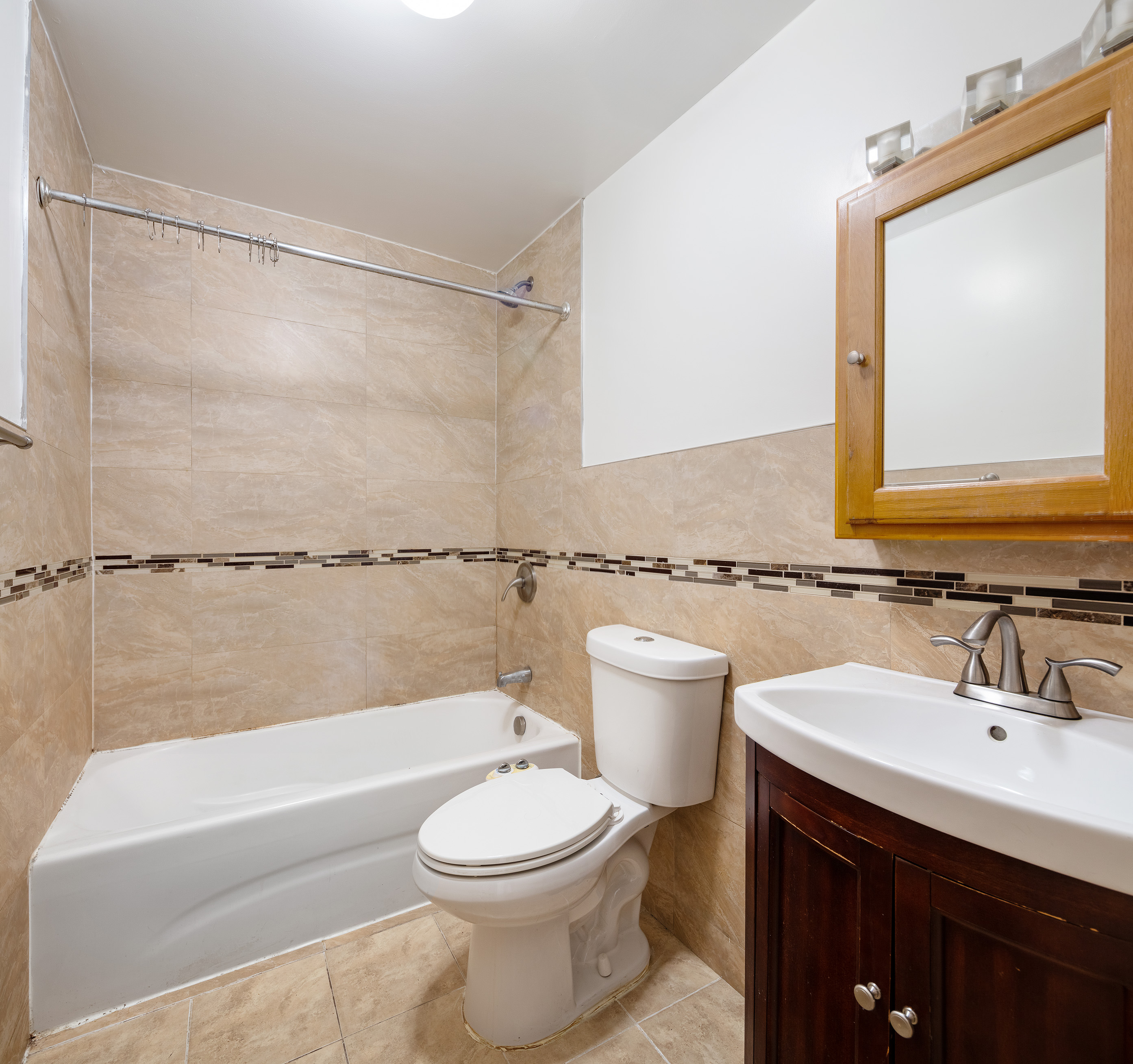14 Covert Street, Unit 1 Brooklyn, NY 11207 - Photo 5 of 9 a bathroom with a sink a toilet and a bathtub