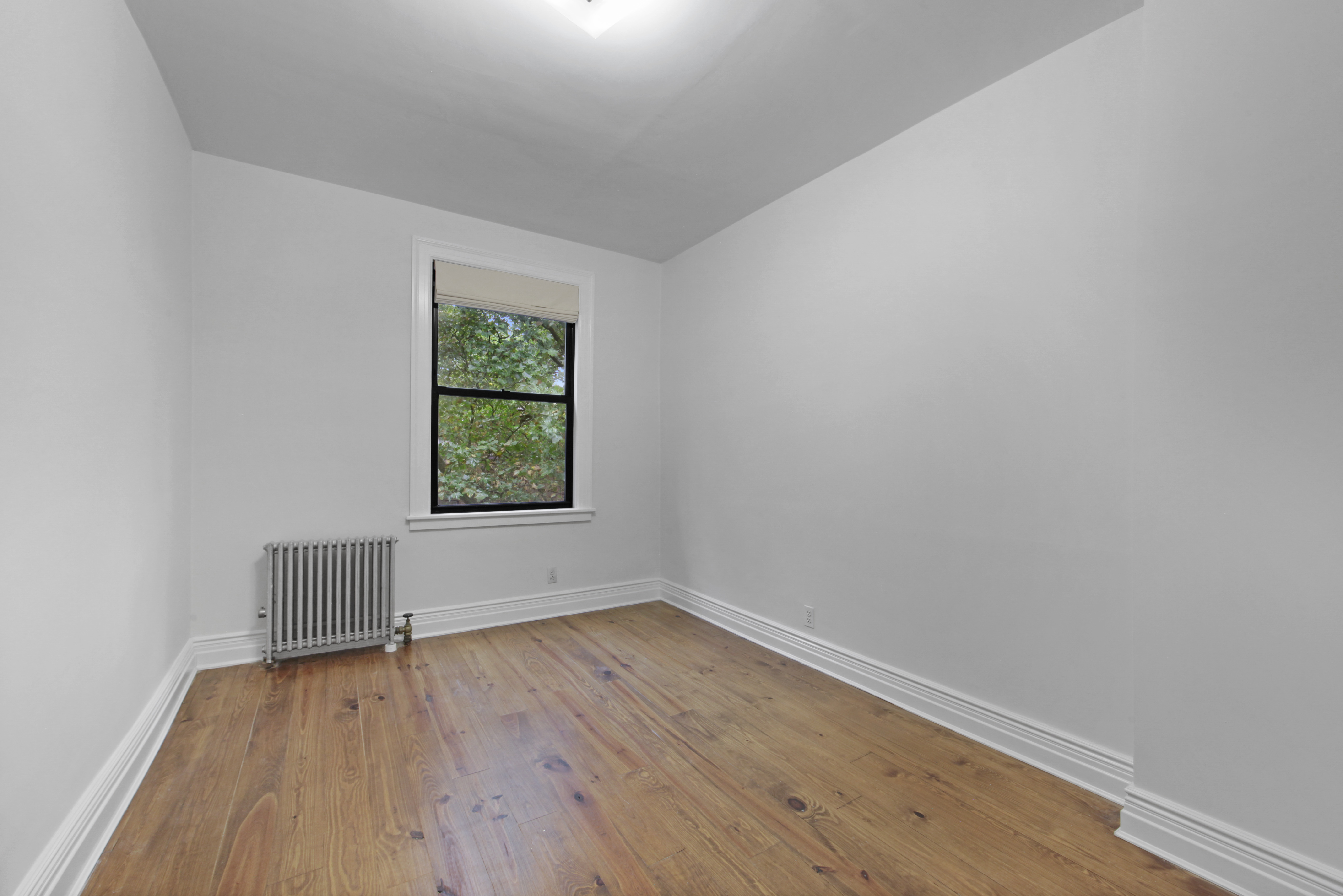 43 Douglass Street, Unit 3 Brooklyn, NY 11231 - Photo 6 of 12 an empty room with wooden floor and window