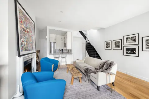 a living room with furniture or couch and a ceiling fan