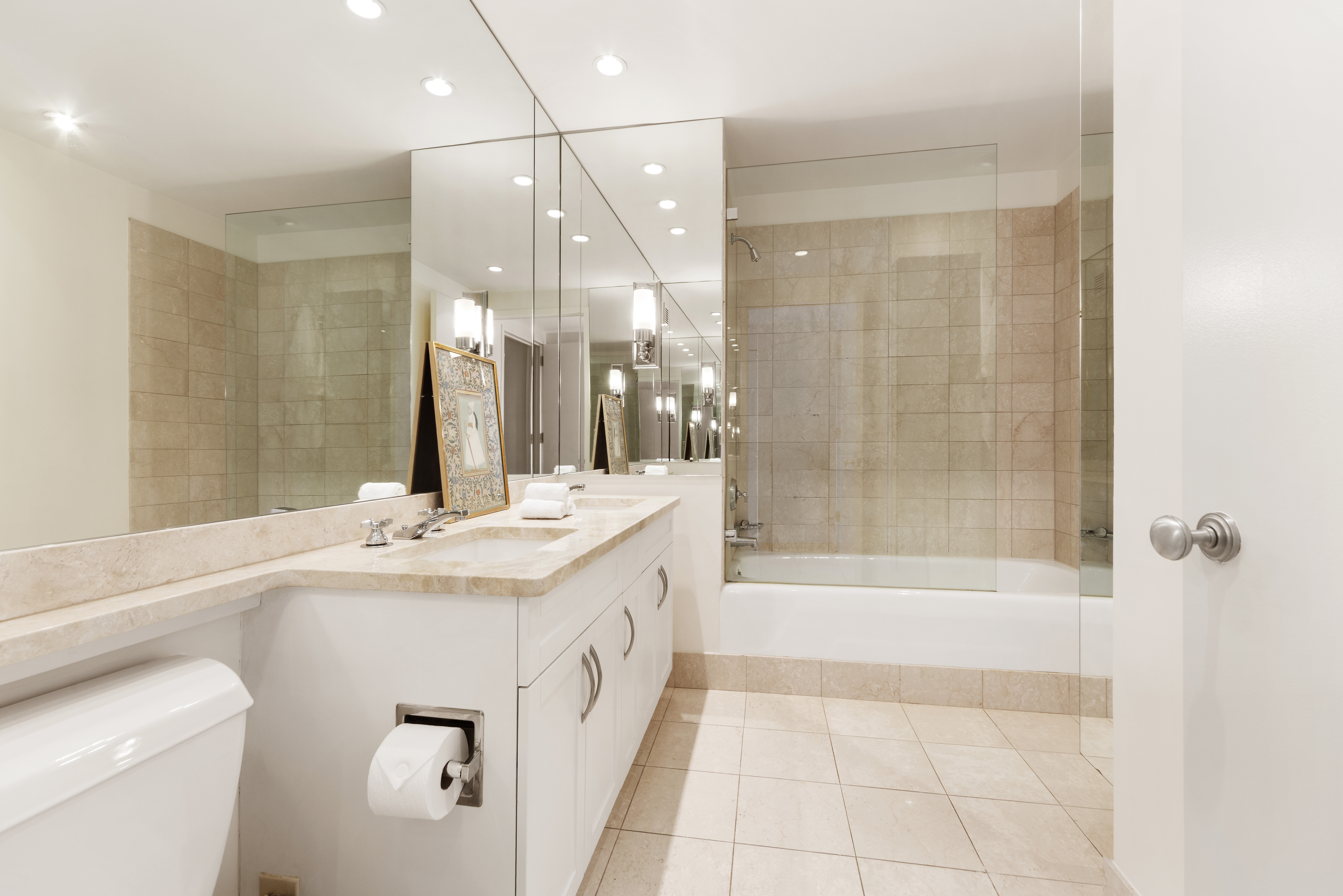 250 East 30th Street, Unit 14B Manhattan, NY 10016 - Photo 11 of 14 a bathroom with a granite countertop sink a toilet a mirror and shower