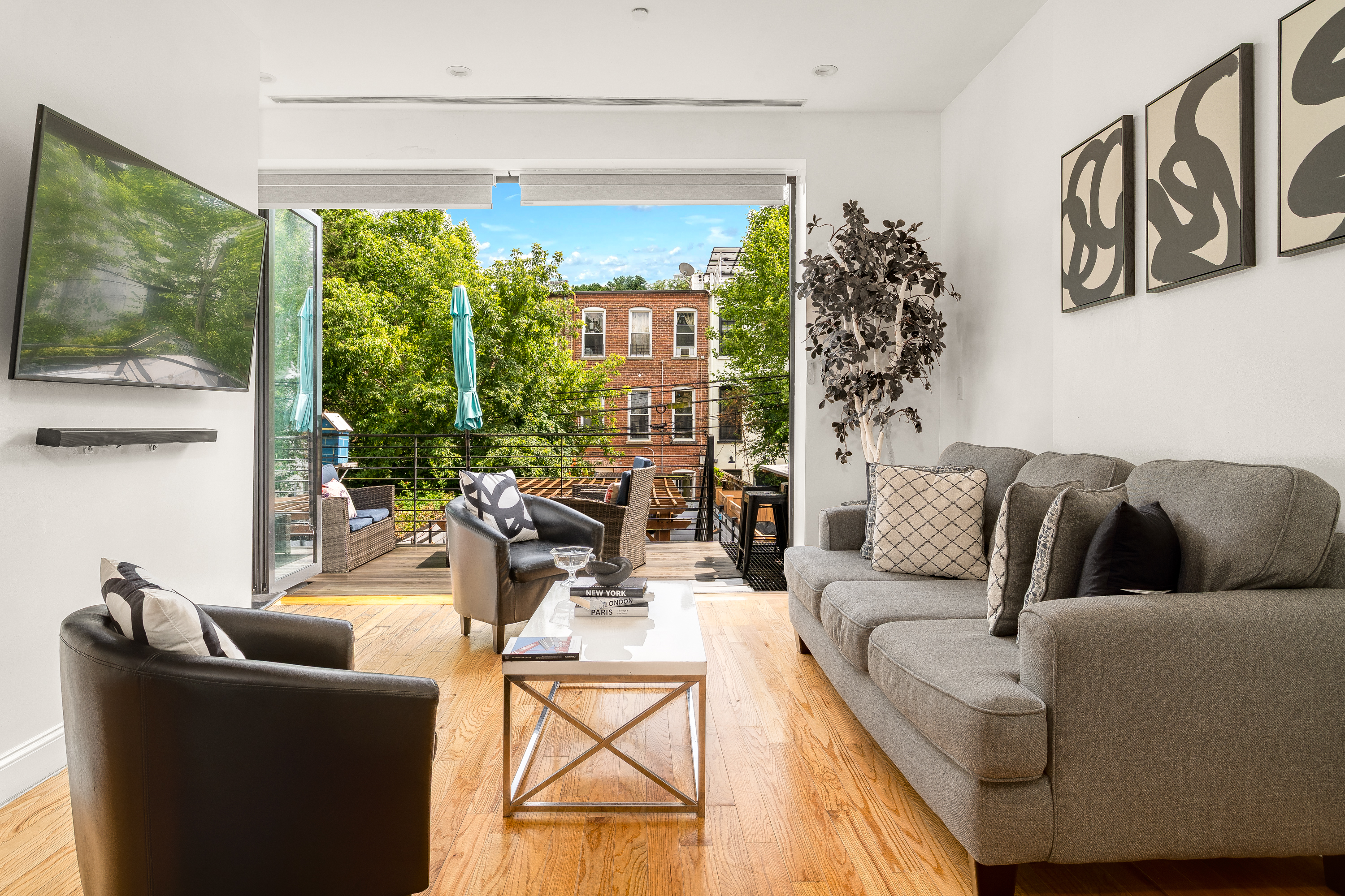 616 MacDonough Street, Unit 2 Brooklyn, NY 11233 - Photo 2 of 12 a living room with furniture and a large window