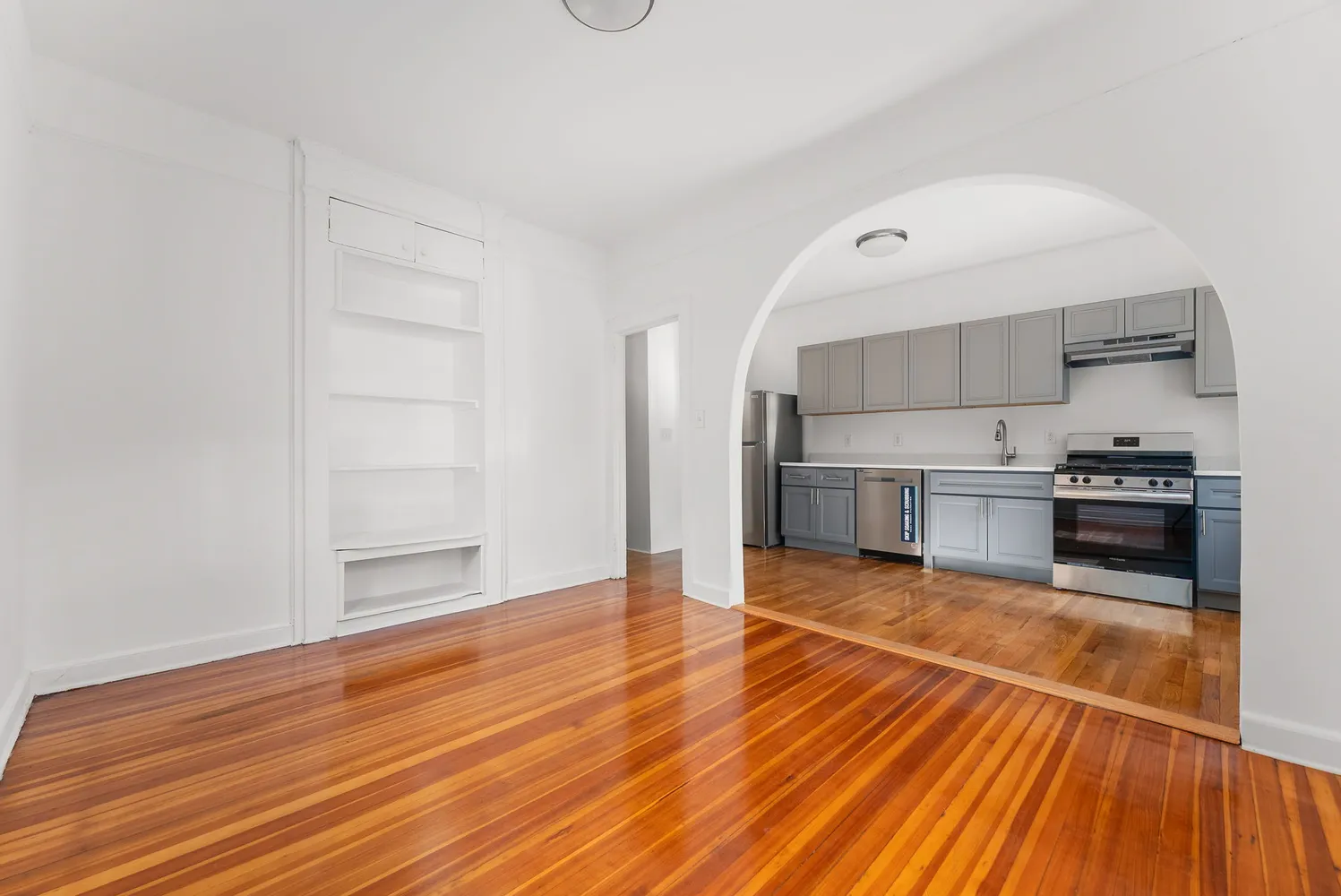 a view of kitchen view wooden floor and electronic appliances