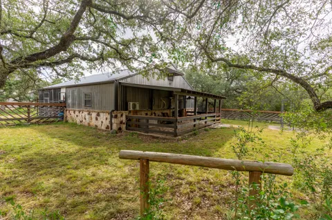 a view of a backyard of the house