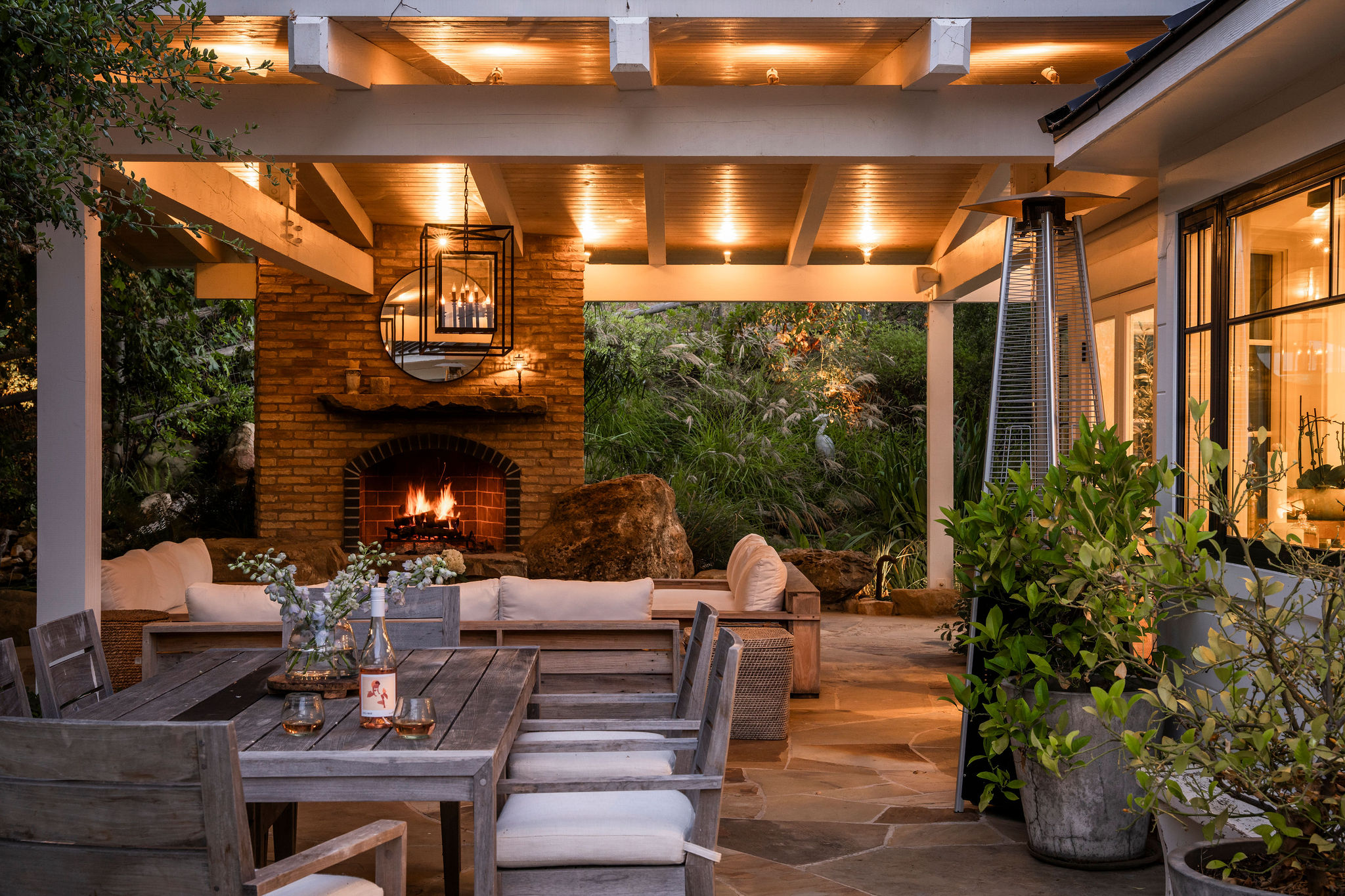 560 Cold Canyon Road Calabasas, CA 91302 - Photo 6 of 84 a outdoor living space with patio furniture and a fireplace