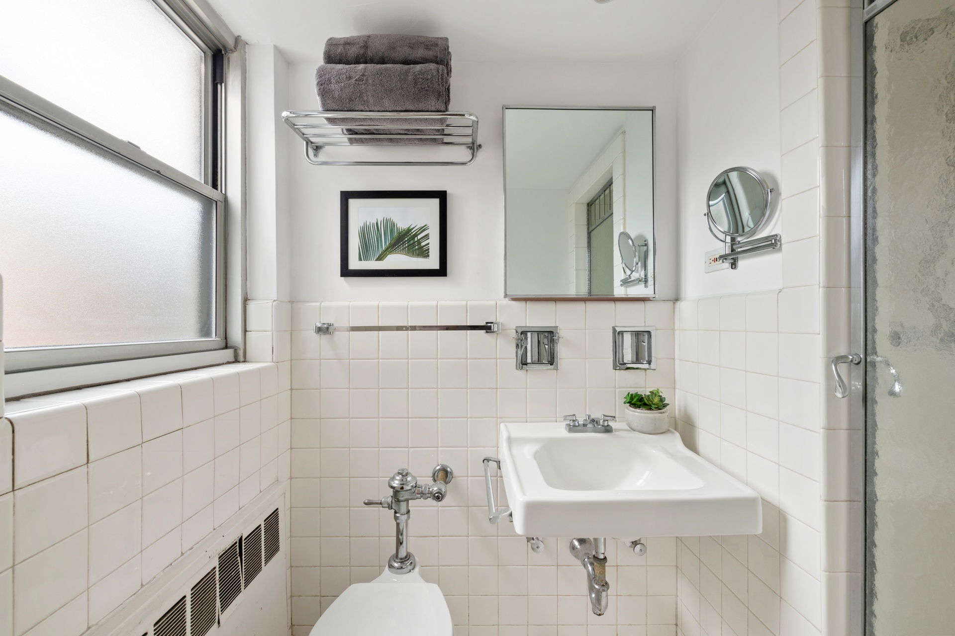 70 East 10th Street, Unit 15R Manhattan, NY 10003 - Photo 10 of 12 a bathroom with a sink and a mirror