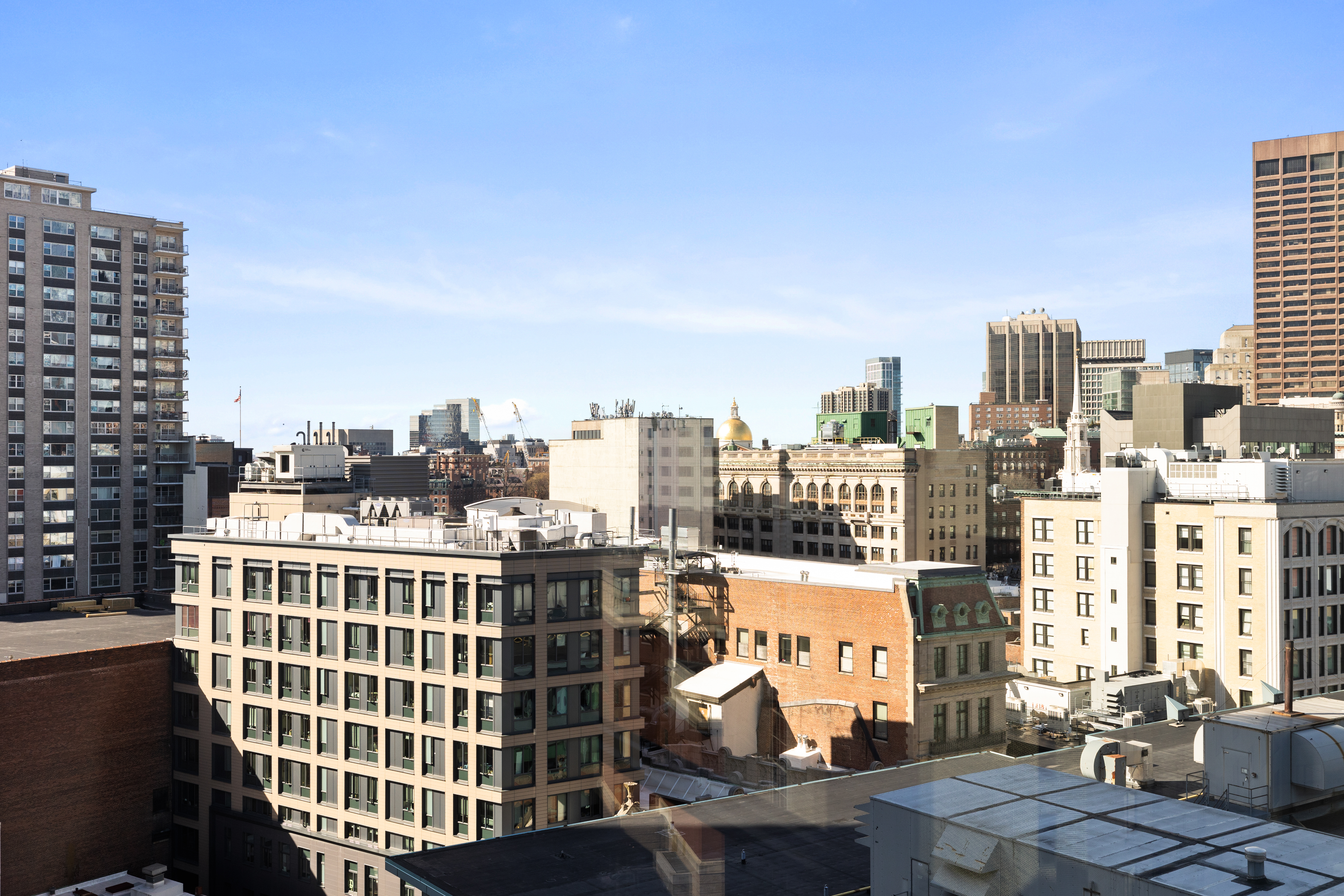 580 Washington Street, Unit PH5 Boston, MA 02111 - Photo 12 of 12 a view of a city that has tall buildings