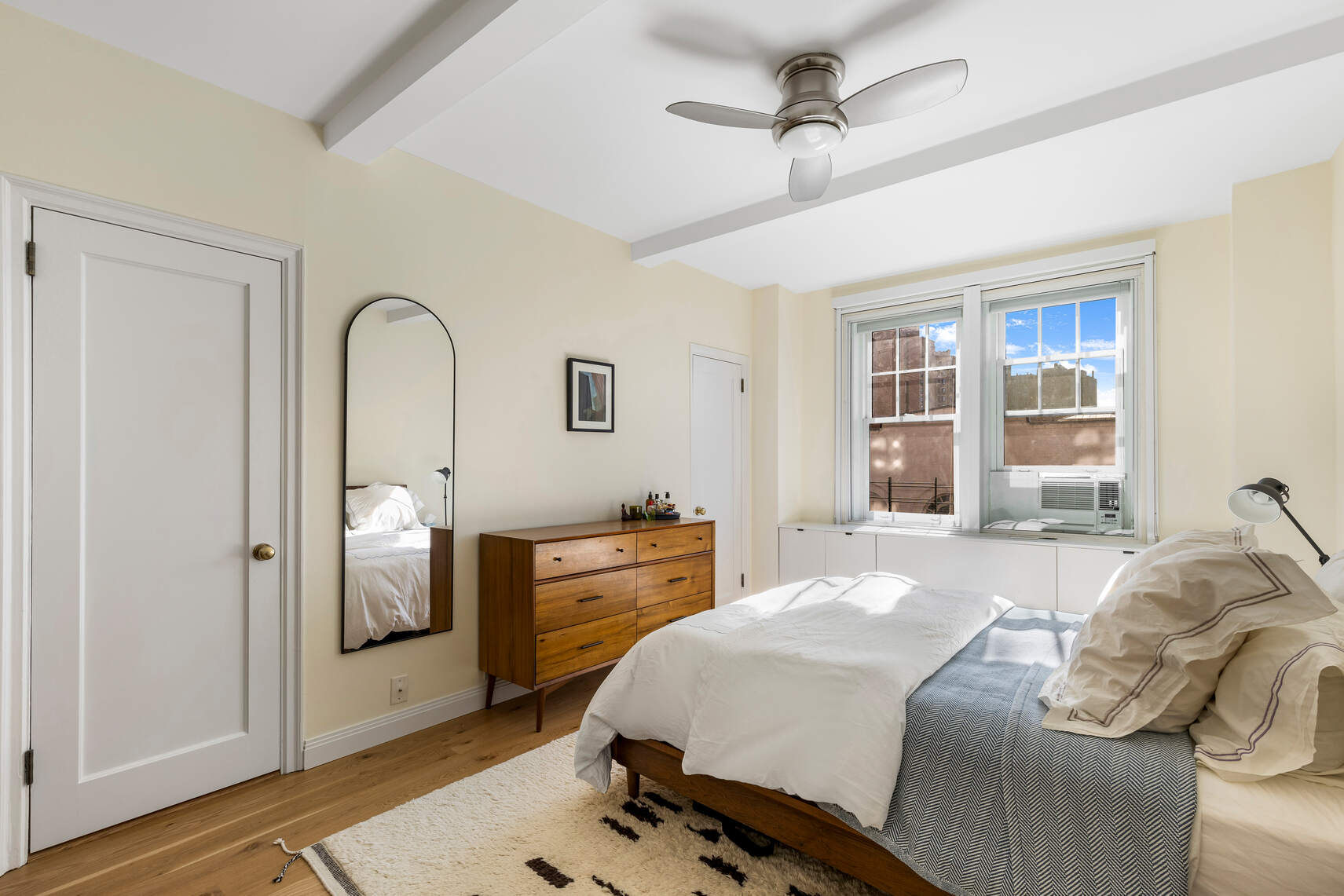 47 Plaza Street West, Unit 5B Brooklyn, NY 11217 - Photo 12 of 14 a bedroom with a bed and wooden floor