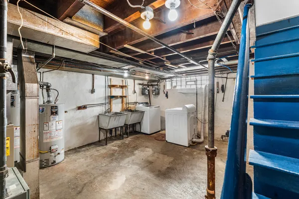 a view of a room with refrigerator and washer