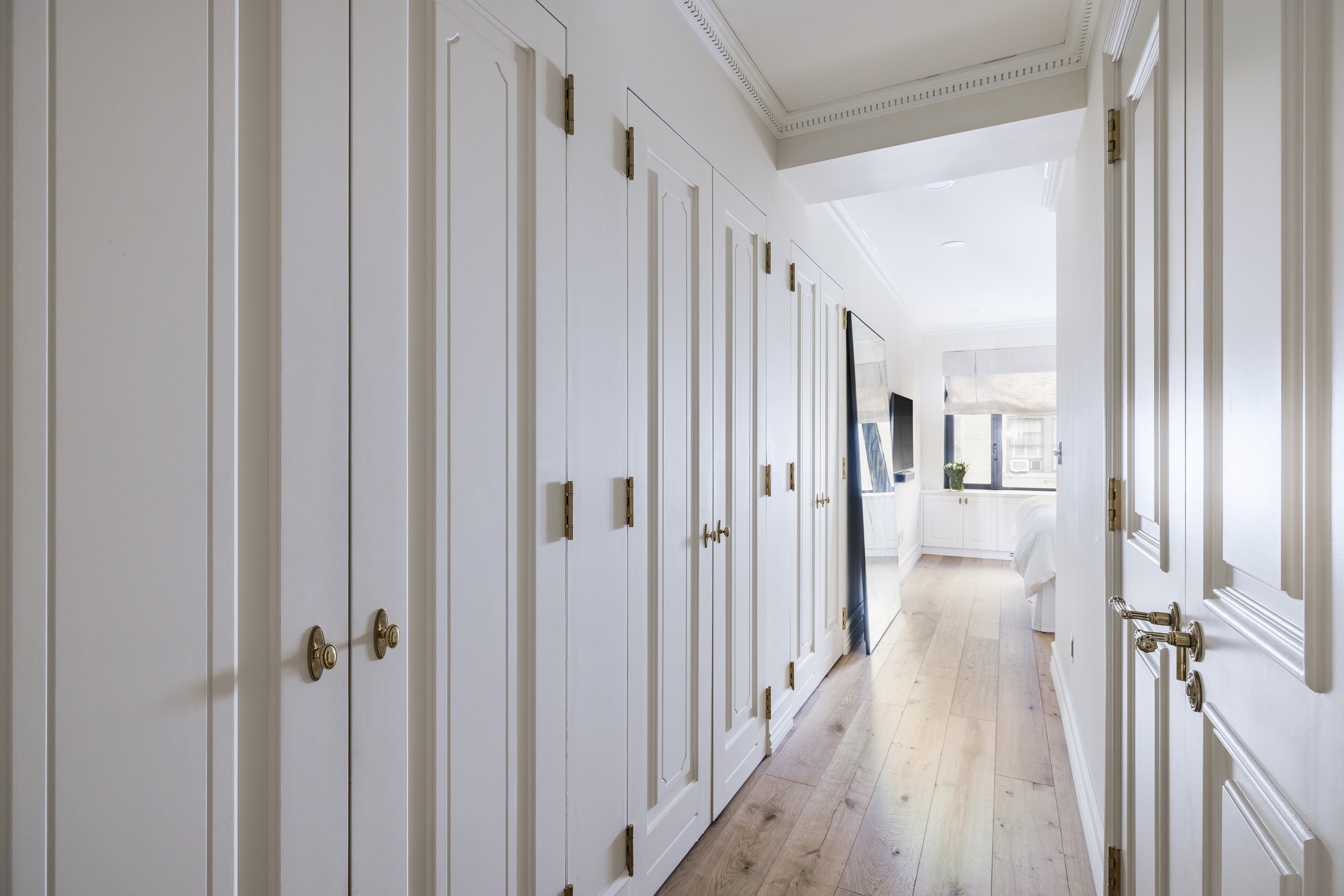 47 East 87th Street, Unit 7A Manhattan, NY 10128 - Photo 11 of 22 a view of a hallway with a wooden door