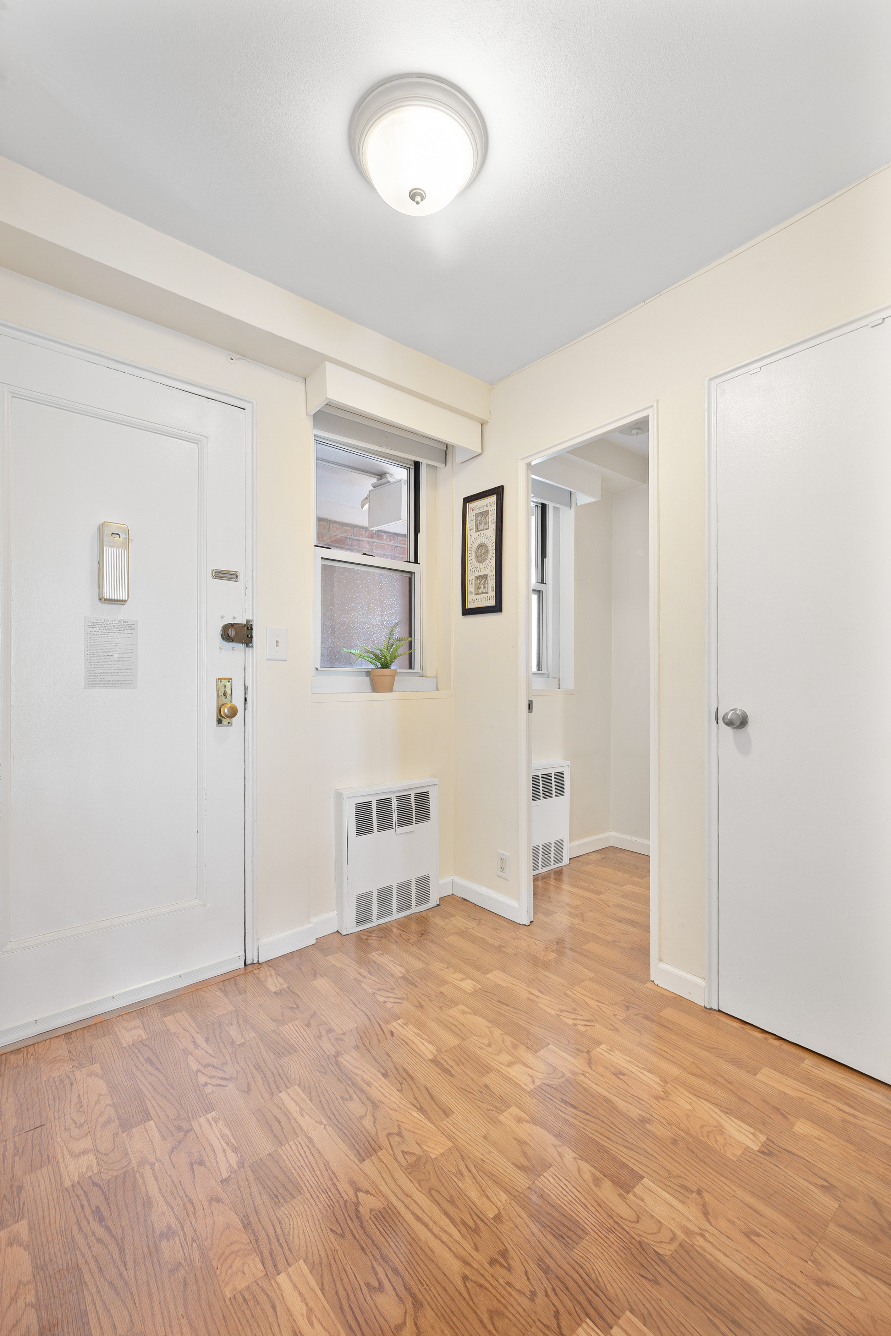 35-51 85th Street, Unit 9N Queens, NY 11372 - Photo 7 of 10 a view of a livingroom with wooden floor