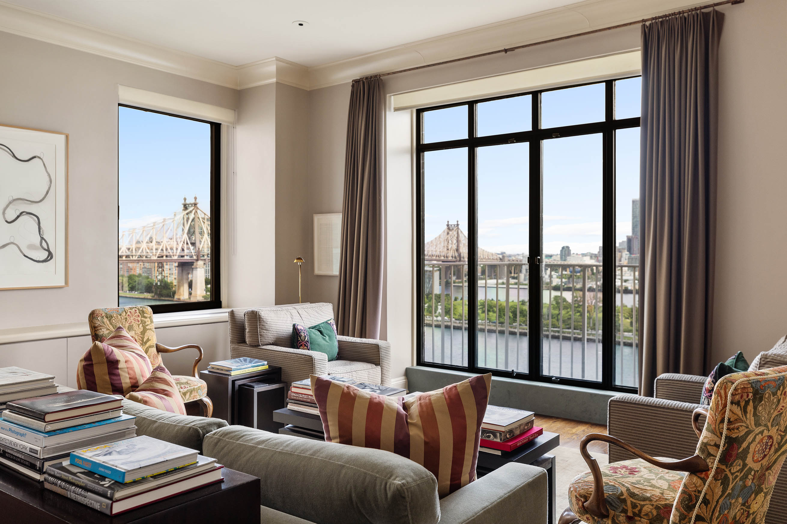 435 East 52nd Street, Unit 11A Manhattan, NY 10022 - Photo 9 of 21 a living room with furniture and large windows