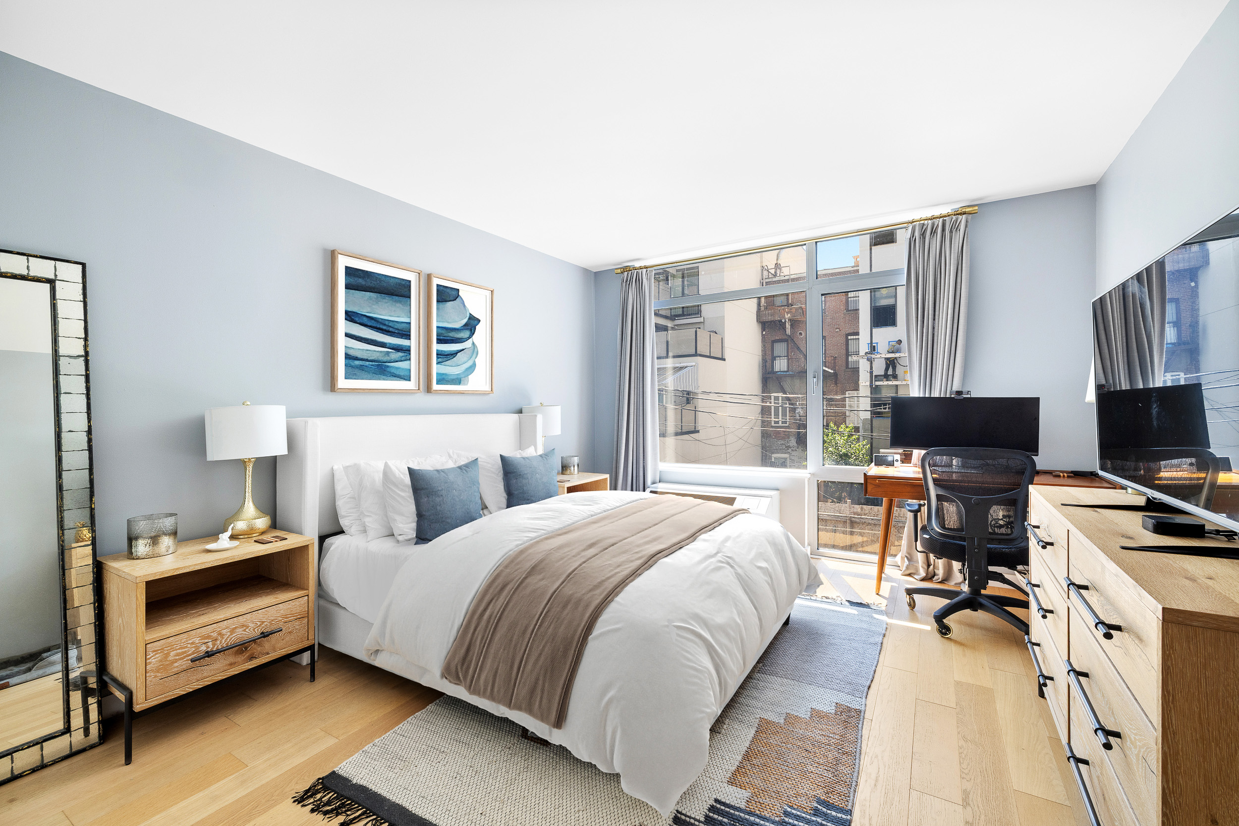 192 Spencer Street, Unit 3A Brooklyn, NY 11205 - Photo 6 of 12 a bedroom with a bed and wooden floor