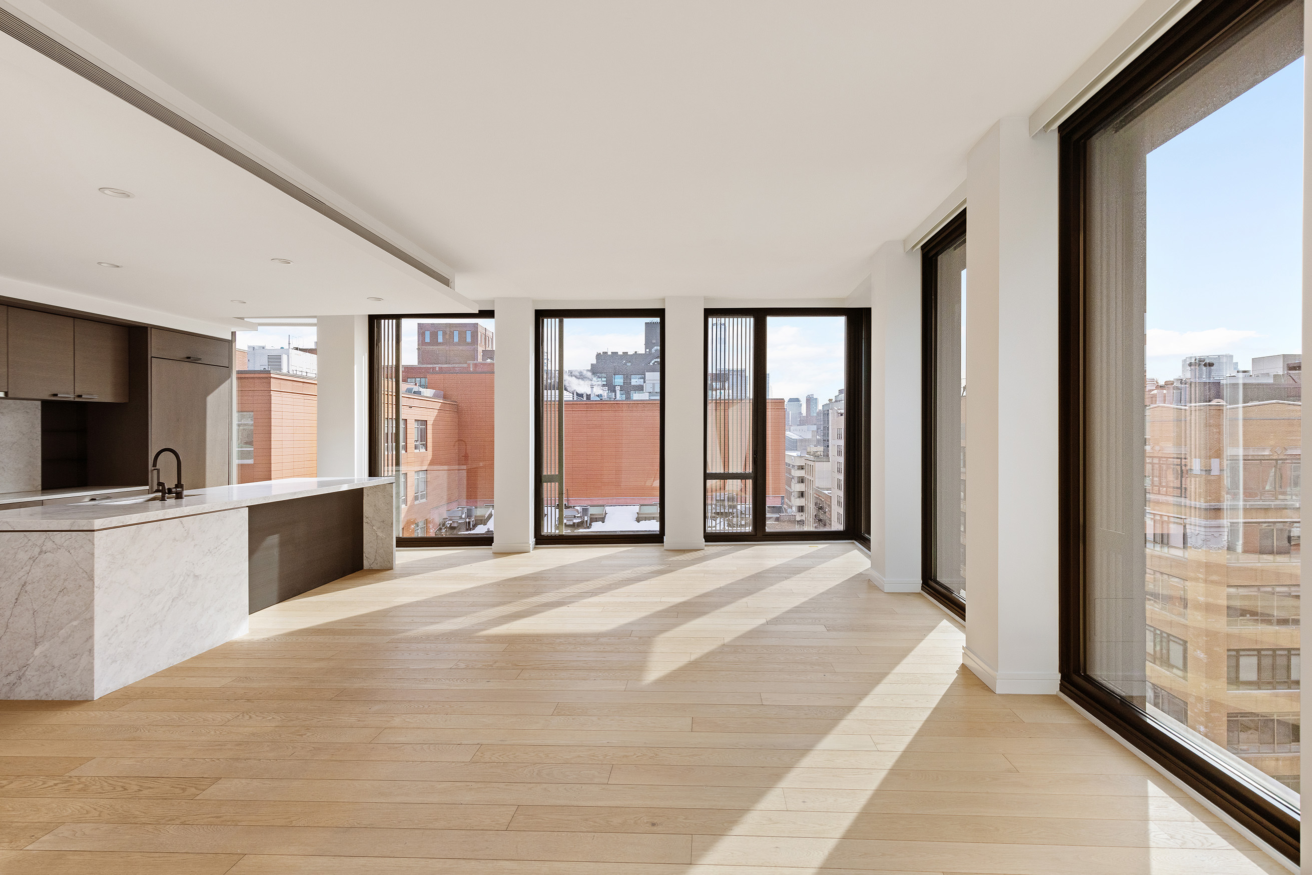100 Barrow Street, Unit 11A Manhattan, NY 10014 - Photo 5 of 16 a large bedroom with a large bed and a large window